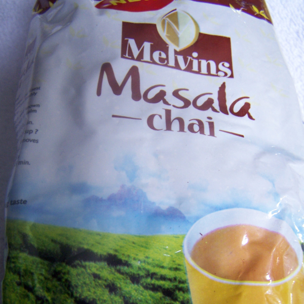 Melvins Masala Chai 250g loose-leaf Kenyan black tea bag with brewed spiced chai cup