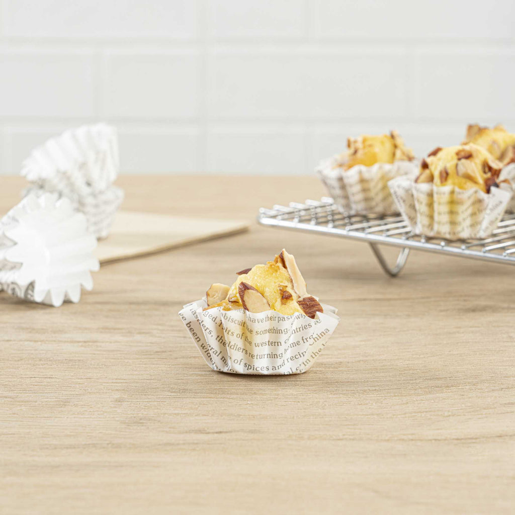 Panificio 0.4 oz Round Newsprint Paper Mini Baking Cup - Flared - 2" x 2" x 1/2" - 200 count box