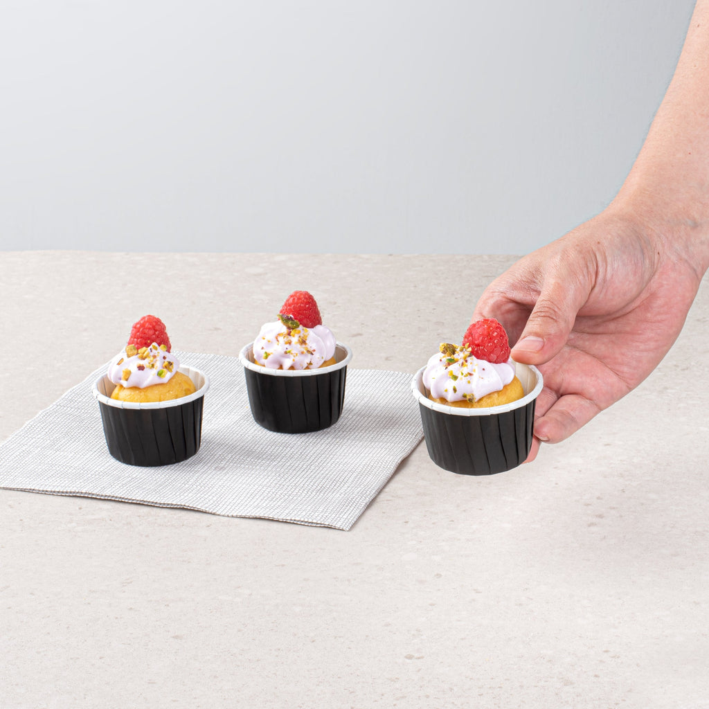 Panificio 2 oz Round Black Paper Medium Baking Cup - Pleated - 2 1/4" x 2 1/4" x 1 1/2" - 200 count box