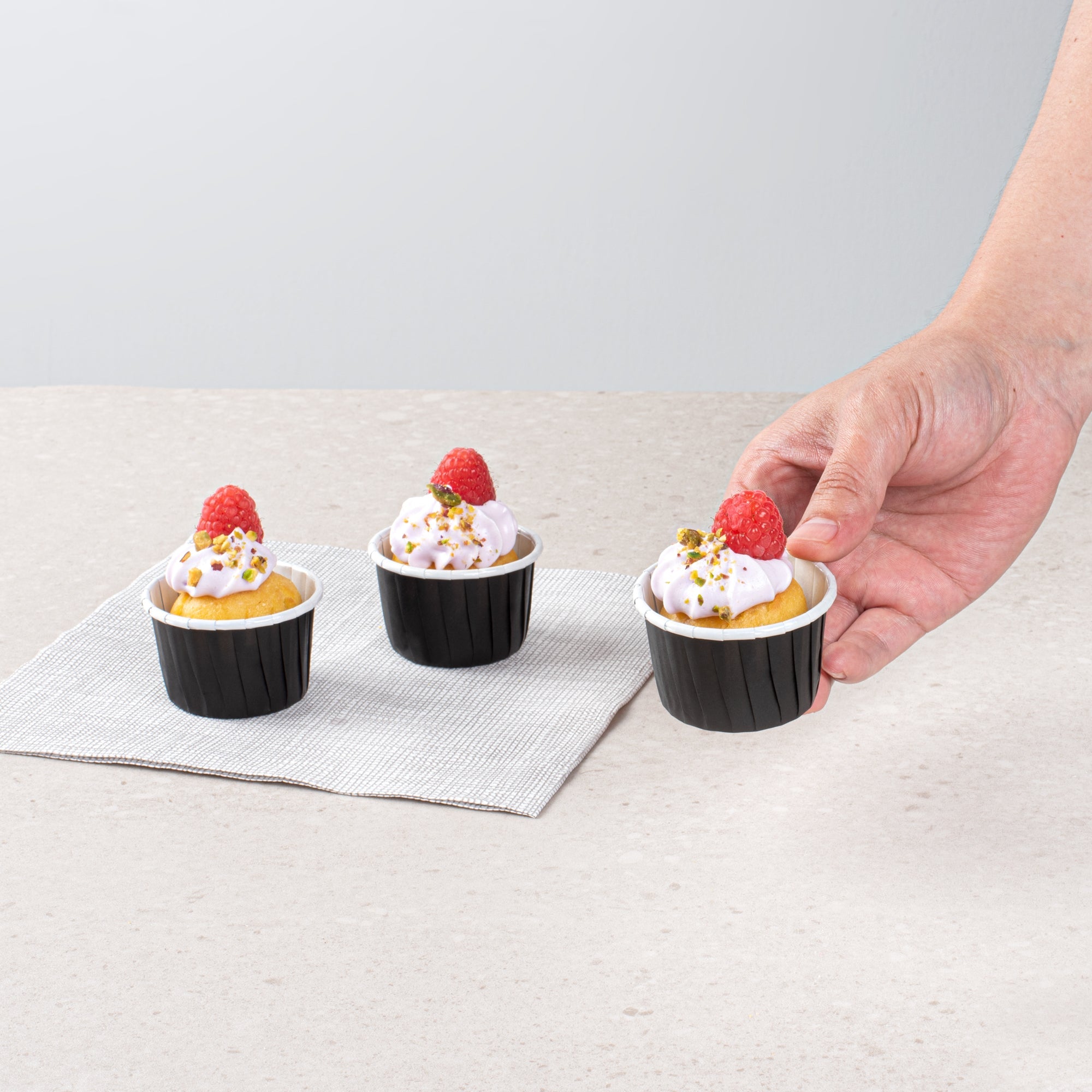 Panificio 2 oz Round Black Paper Medium Baking Cup - Pleated - 2 1/4" x 2 1/4" x 1 1/2" - 200 count box