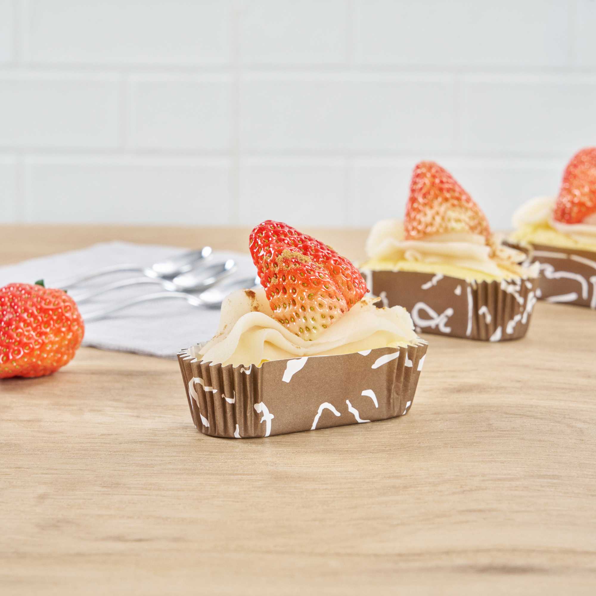 Panificio 1 oz Elliptical Chocolate Wisp Paper Regular Baking Cup - Ridged - 3 1/2" x 1 1/2" x 1" - 200 count box