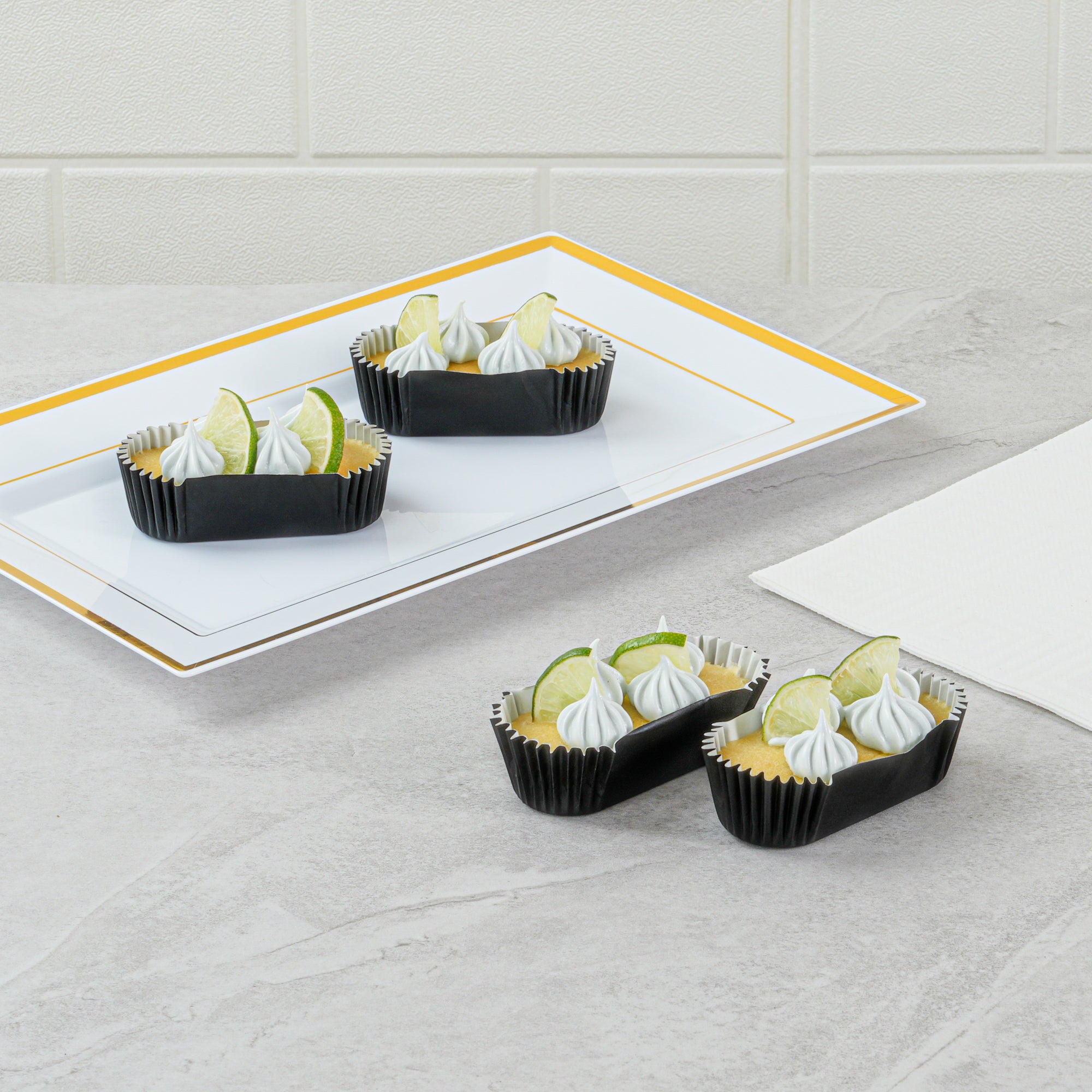 Panificio 1 oz Elliptical Black Paper Regular Baking Cup - Ridged - 3 1/2" x 1 1/2" x 3/4" - 200 count box