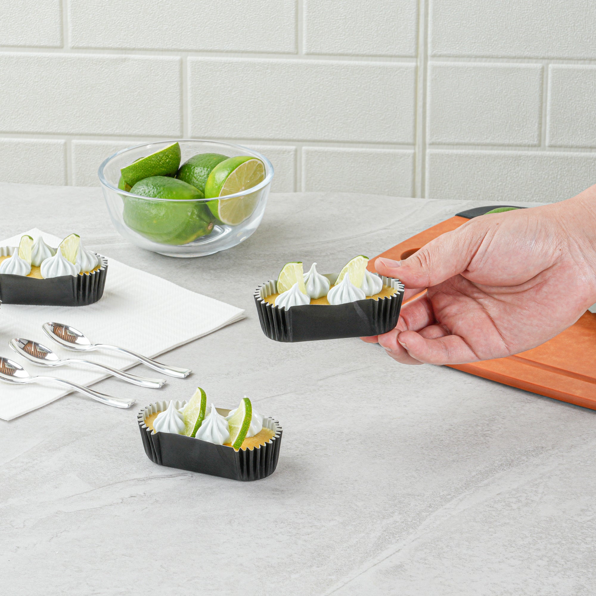Panificio 1 oz Elliptical Black Paper Regular Baking Cup - Ridged - 3 1/2" x 1 1/2" x 3/4" - 200 count box