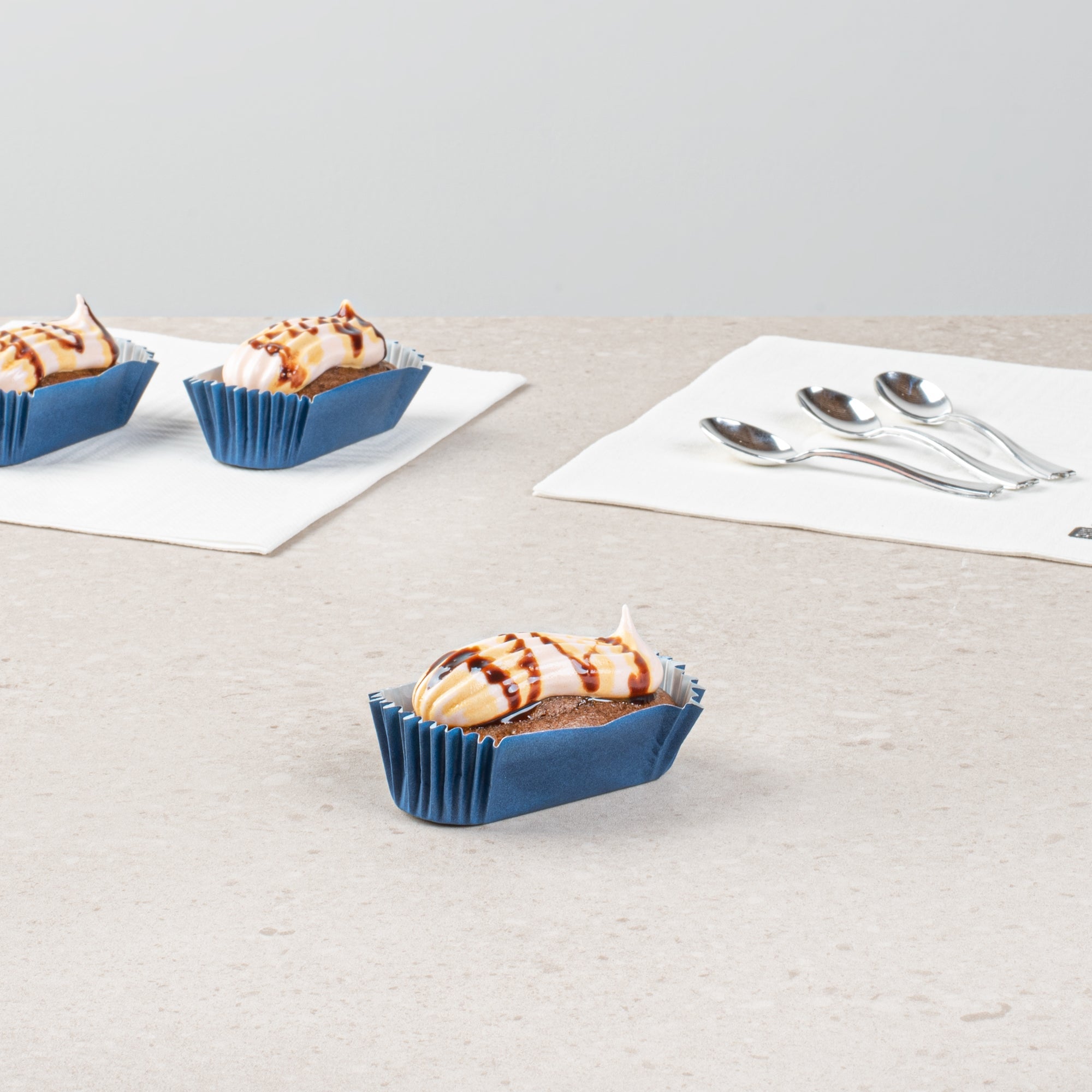 Panificio 1 oz Elliptical Midnight Blue Paper Regular Baking Cup - Ridged - 3 1/2" x 1 1/2" x 3/4" - 200 count box