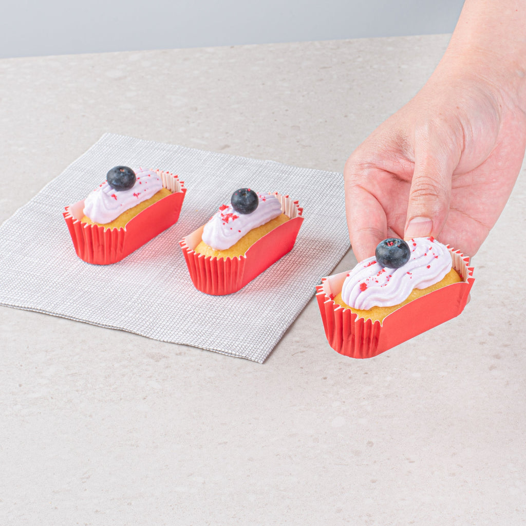 Panificio 1 oz Elliptical Red Paper Regular Baking Cup - Ridged - 3 1/2" x 1 1/2" x 3/4" - 200 count box