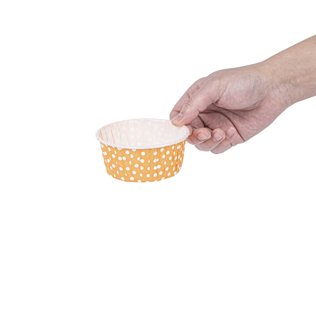 Panificio 5 oz Round Polka-Dotted Hot Orange Paper Large Baking Cup - Pleated - 3 3/4" x 3 3/4" x 1 1/2" - 200 count box