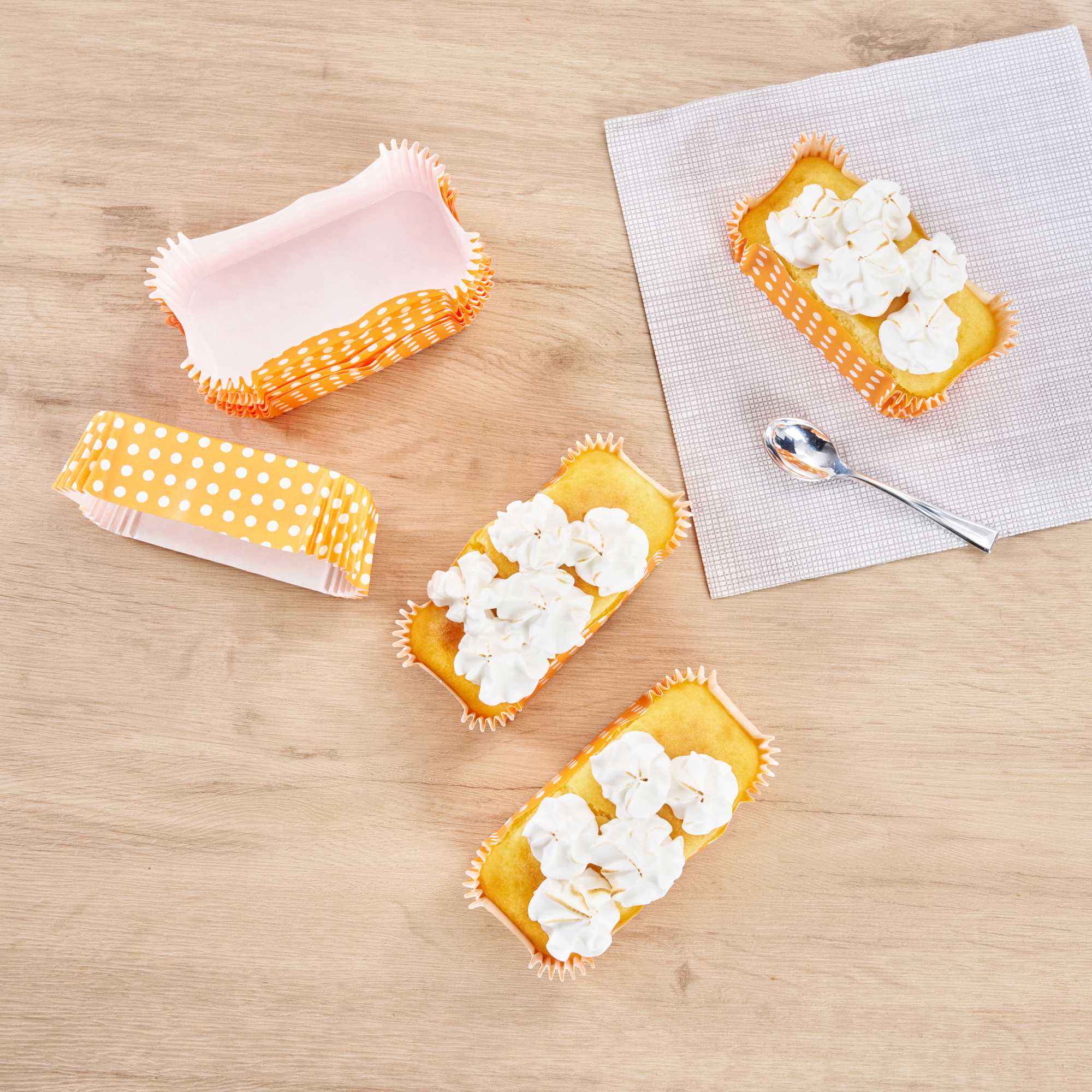 Panificio 5 oz Elliptical Polka-Dotted Hot Orange Paper Large Baking Cup - Ridged - 4 1/2" x 2 1/2" x 1 1/4" - 200 count box