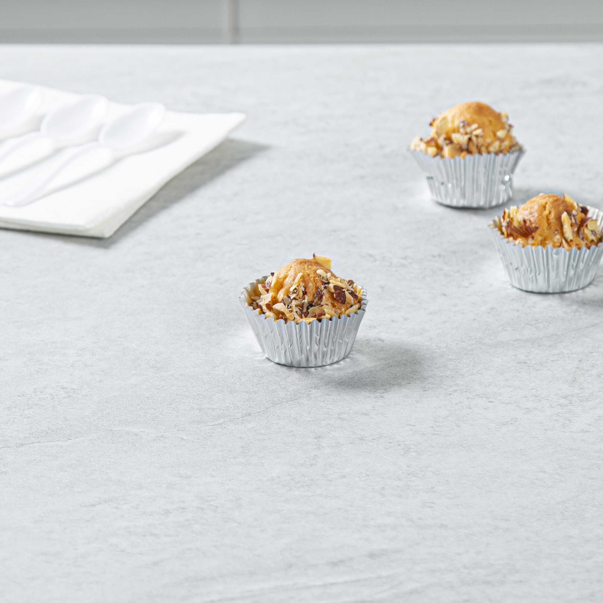 Panificio 0.4 oz Round Metallic Silver Paper Baking Cup - Foil-Coated - 1 1/4" x 1 1/4" x 3/4" - 200 count box