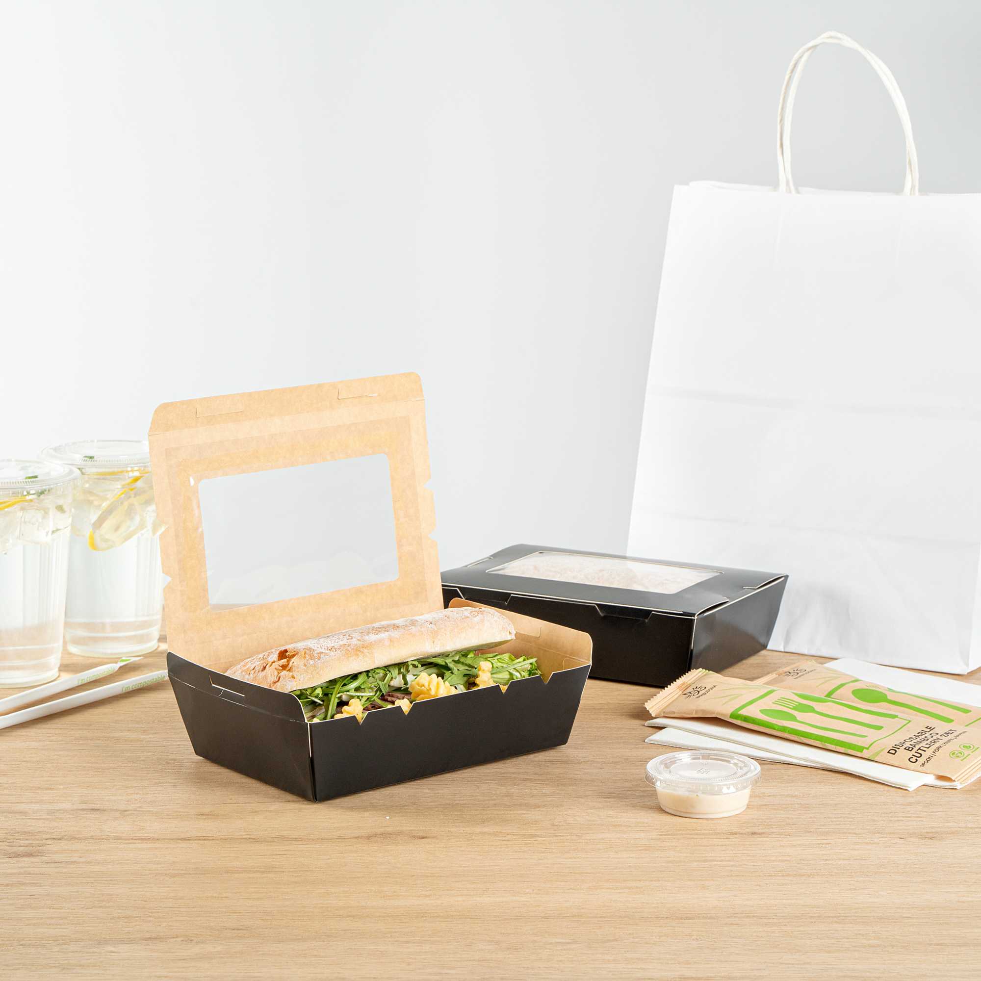 Cafe Vision 42 oz Black Paper Medium Take Out Container - Hinge Lock - 8" x 5 1/2" x 2" - 50 count box
