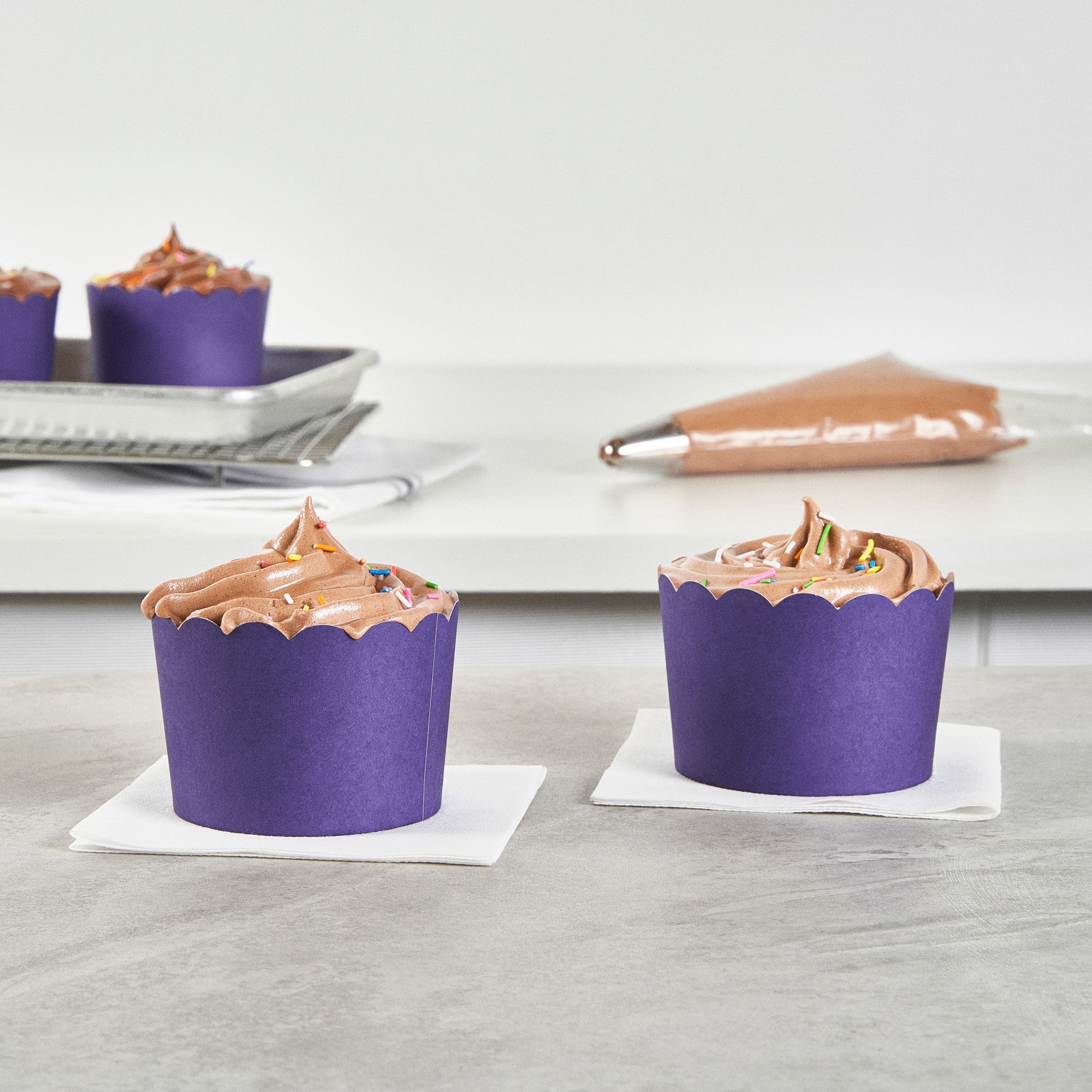 Panificio 10 oz Round Purple Paper Jumbo Baking Cup - Scalloped - 3 1/2" x 3 1/2" x 2 1/2" - 200 count box