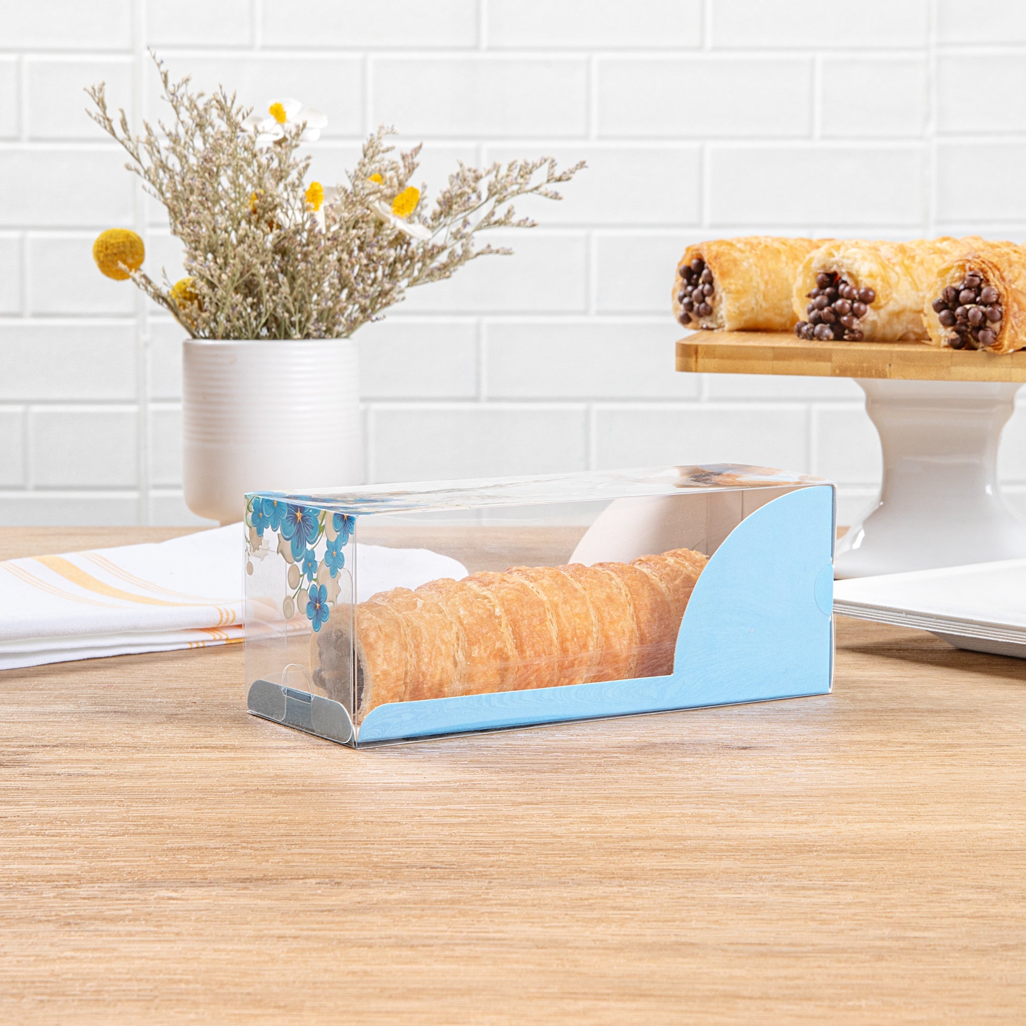 Sweet Vision Rectangle Clear Plastic Eclair Box - Blue Paper Sleeve, Flower Accent - 7" x 2 1/2" x 2 1/2" - 100 count box