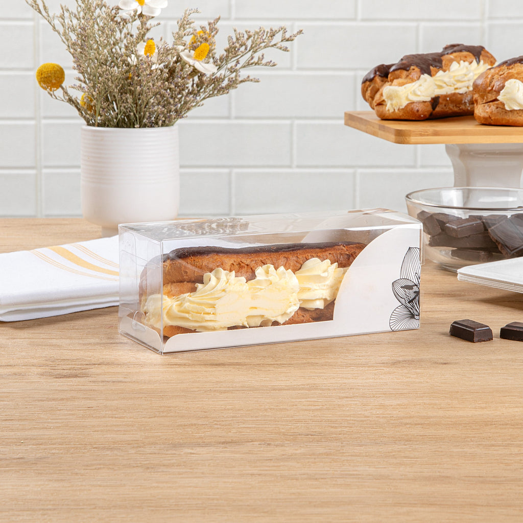 Sweet Vision Rectangle Clear Plastic Eclair Box - White Paper Sleeve, Lotus Accent - 7" x 2 1/2" x 2 1/2" - 100 count box