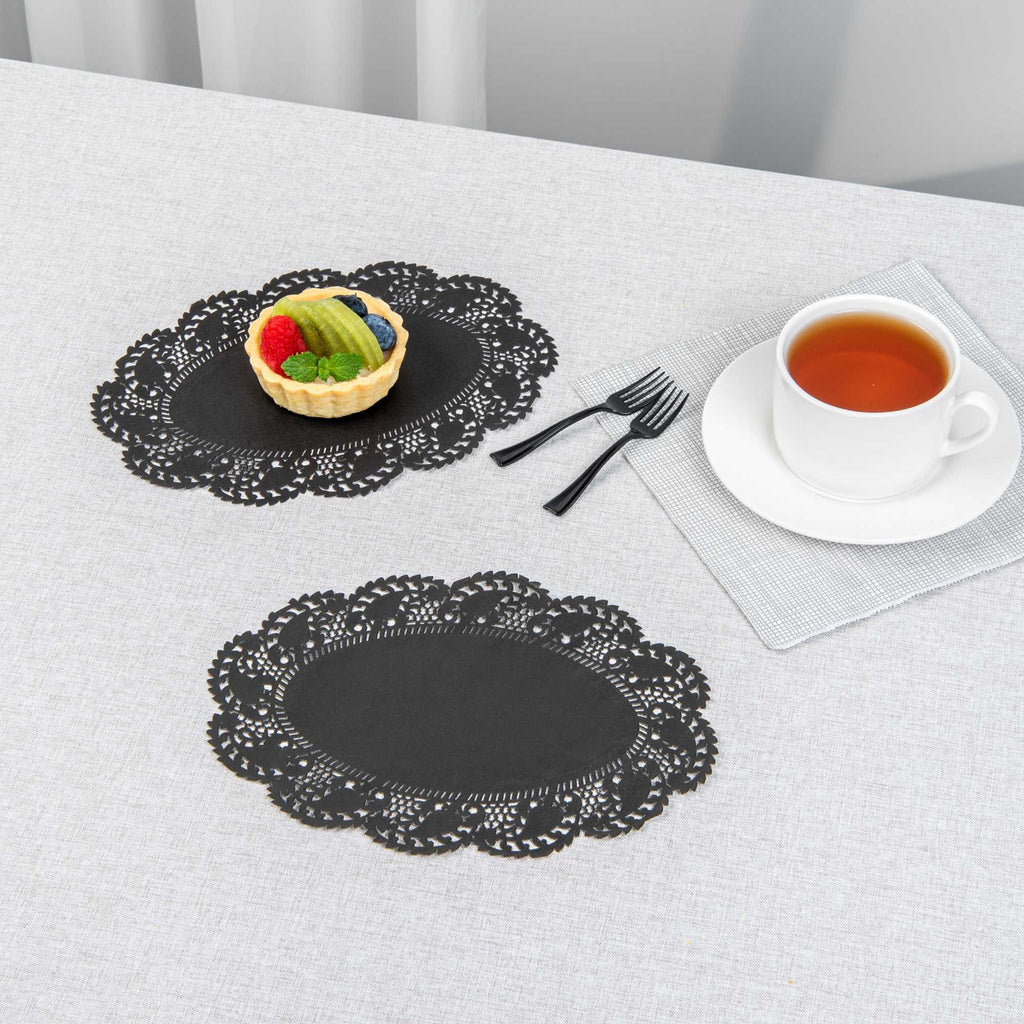 Pastry Tek Oval Black Paper Doilies - Lace - 9" x 6 1/2" - 100 count box