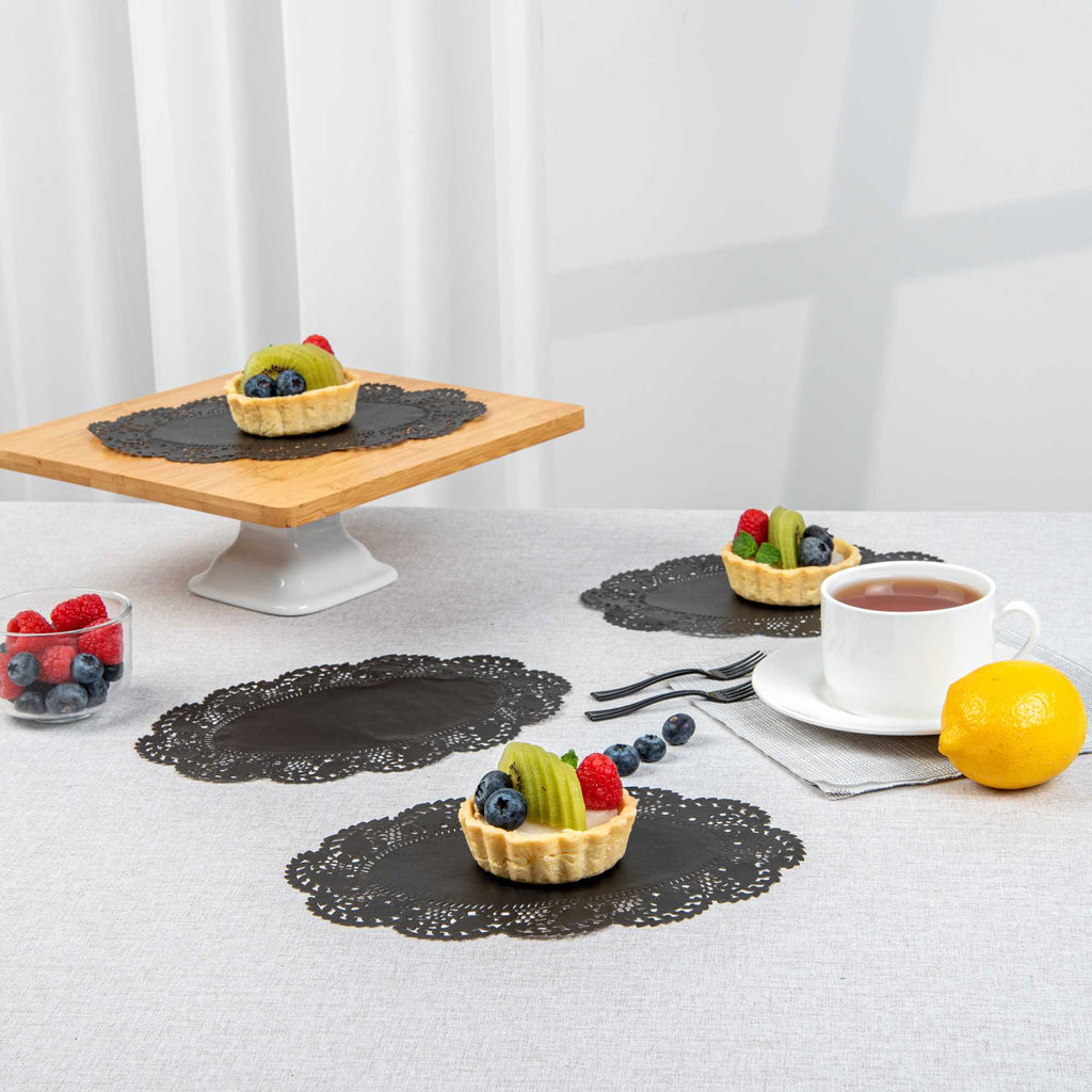 Pastry Tek Oval Black Paper Doilies - Lace - 9" x 6 1/2" - 4000 count box