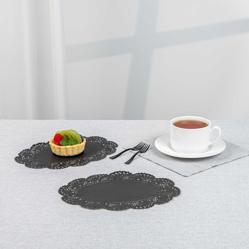 Pastry Tek Oval Black Paper Doilies - Lace - 9" x 6 1/2" - 4000 count box
