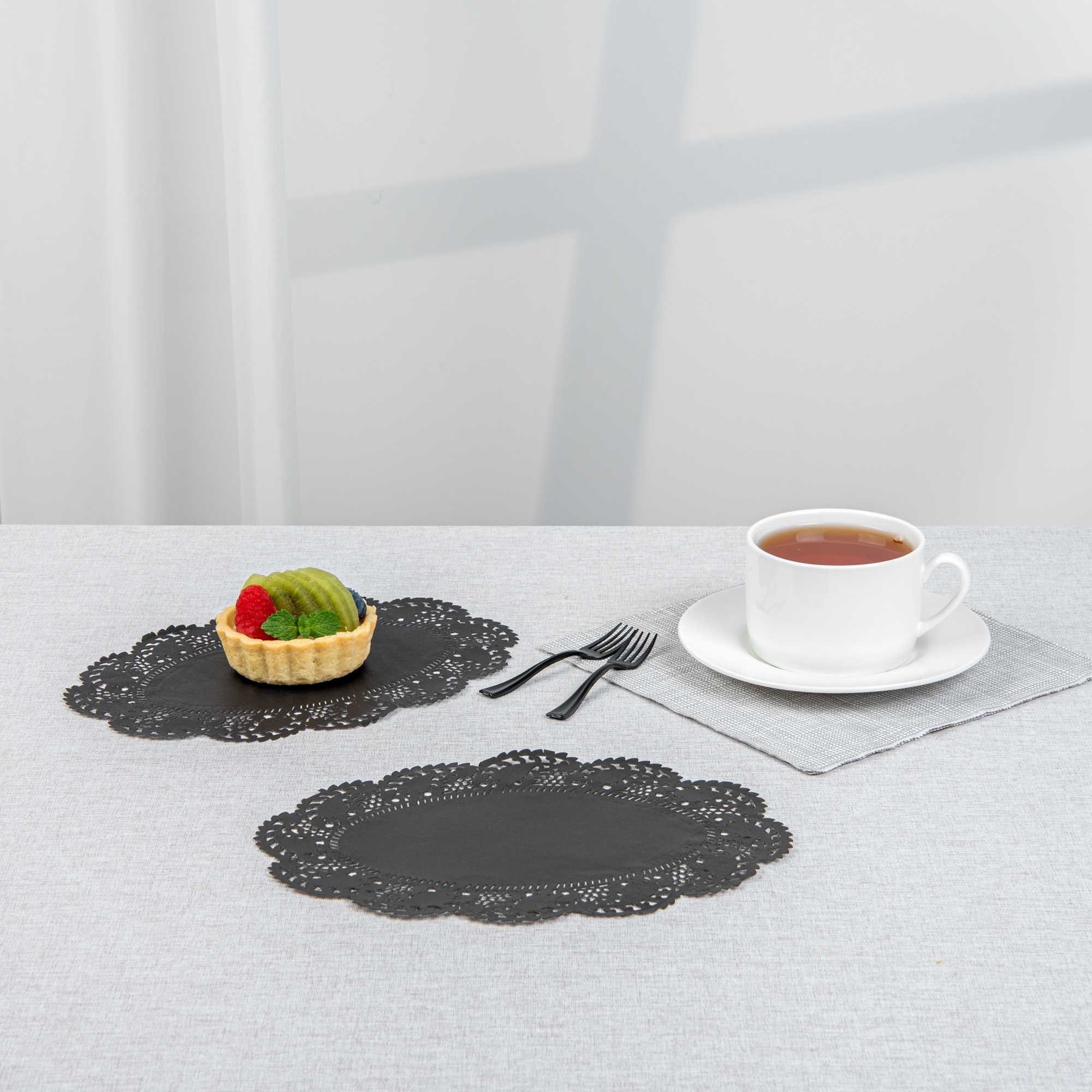 Pastry Tek Oval Black Paper Doilies - Lace - 9" x 6 1/2" - 4000 count box
