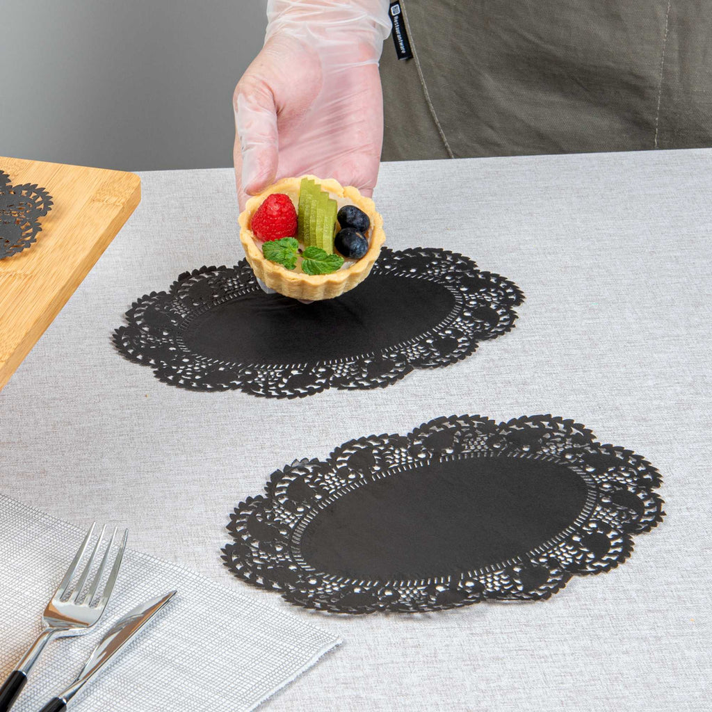 Pastry Tek Oval Black Paper Doilies - Lace - 9" x 6 1/2" - 4000 count box