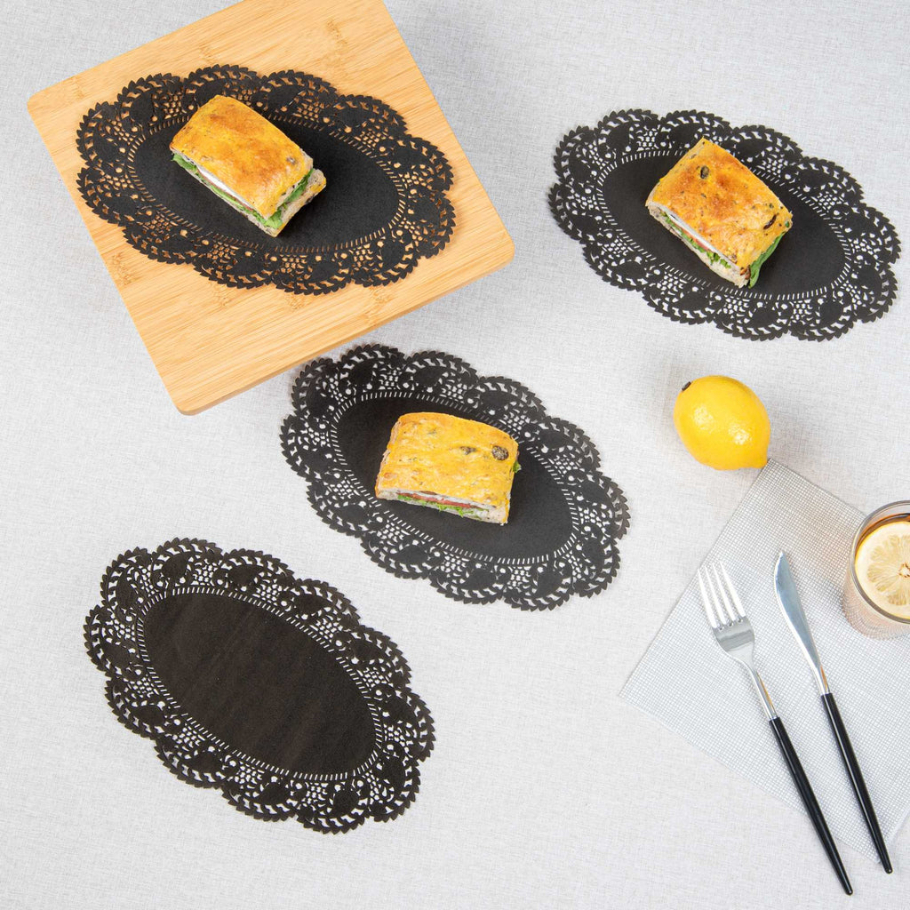 Pastry Tek Oval Black Paper Doilies - Lace - 10 1/2" x 6 1/2" - 4000 count box