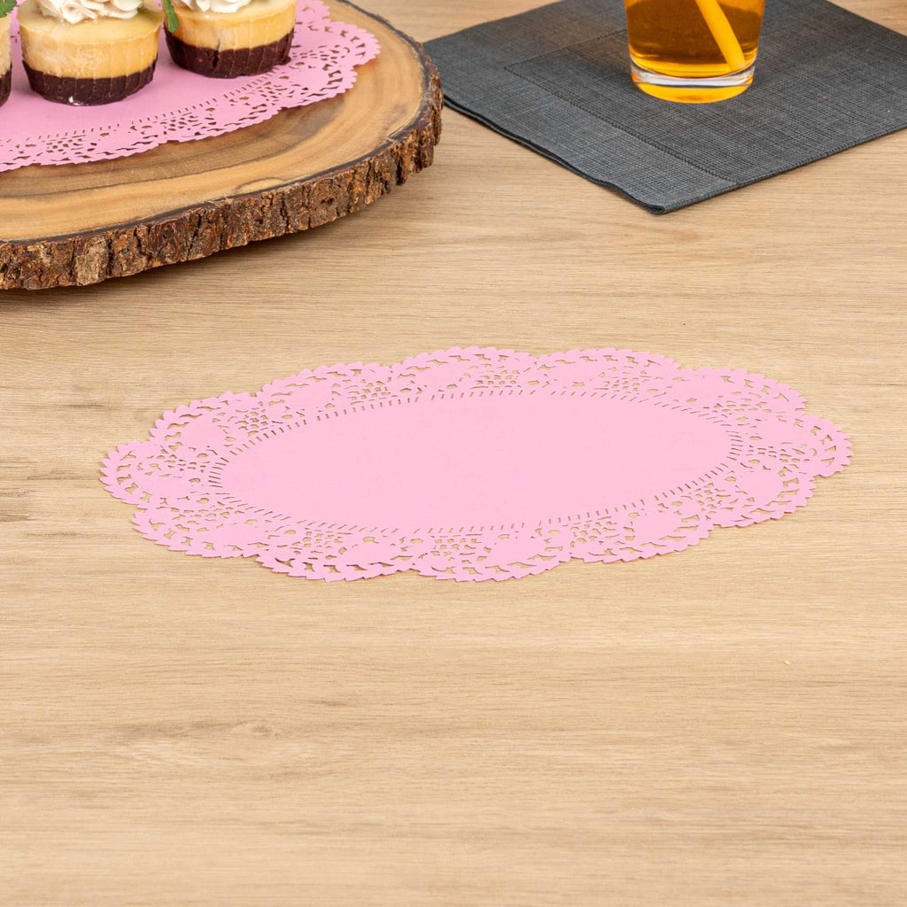Pastry Tek Oval Pink Paper Doilies - Lace - 10 1/2" x 6 1/2" - 100 count box