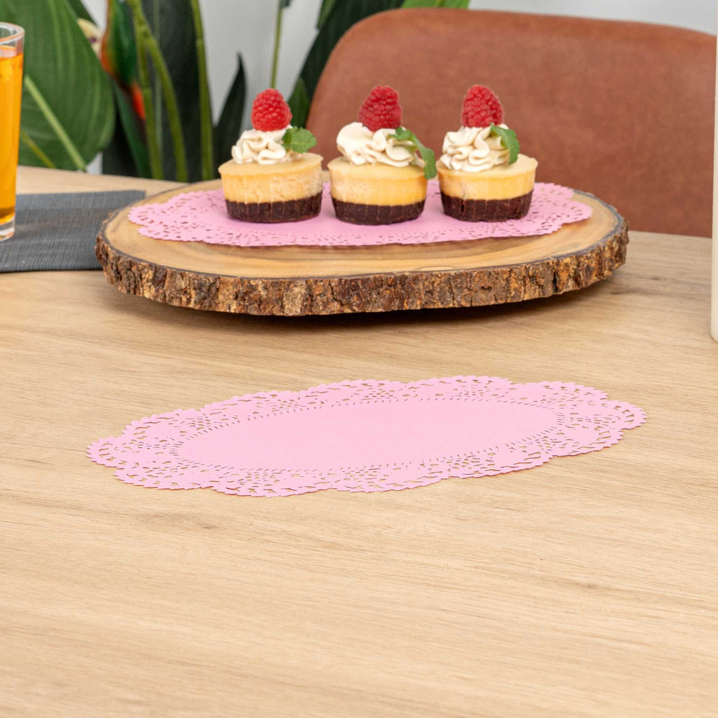Pastry Tek Oval Pink Paper Doilies - Lace - 10 1/2" x 6 1/2" - 100 count box