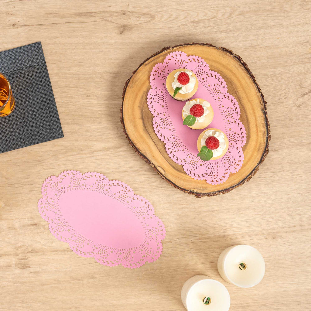 Pastry Tek Oval Pink Paper Doilies - Lace - 10 1/2" x 6 1/2" - 100 count box