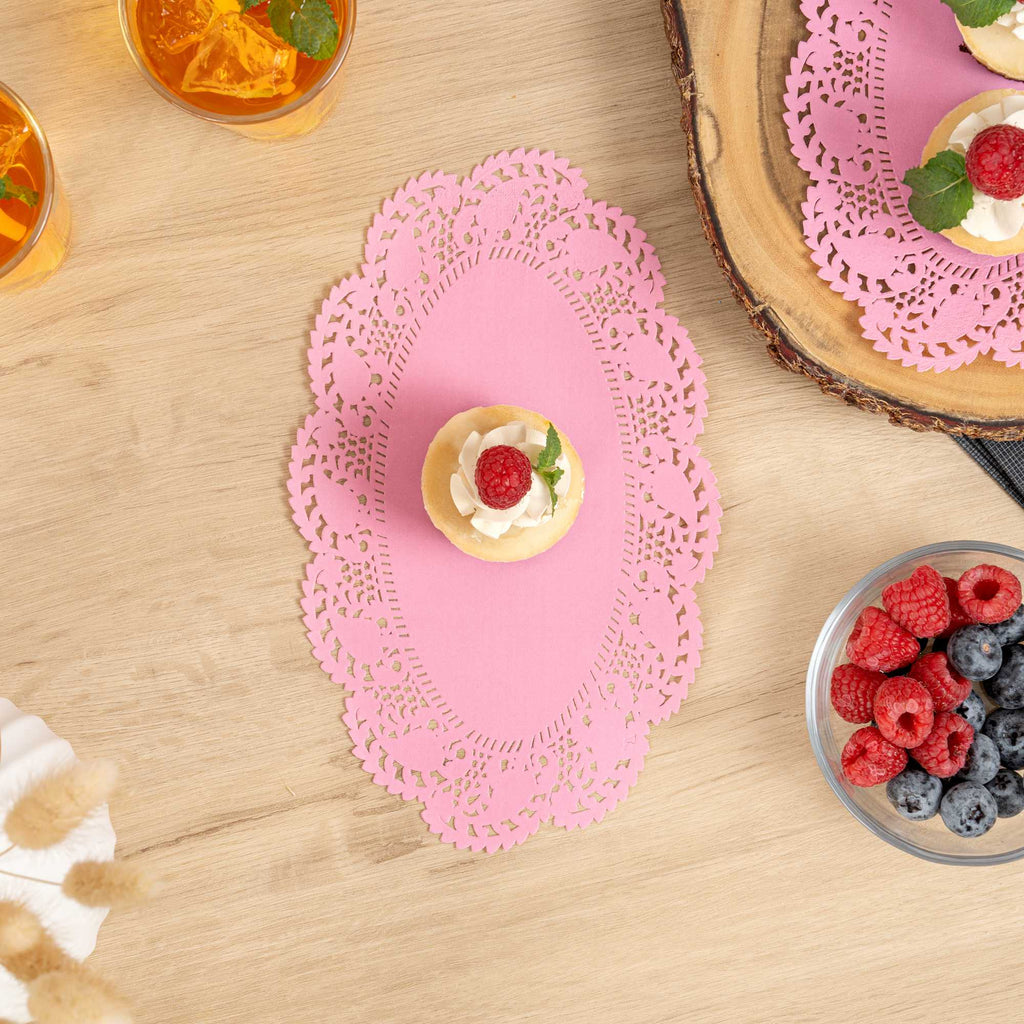 Pastry Tek Oval Pink Paper Doilies - Lace - 10 1/2" x 6 1/2" - 100 count box