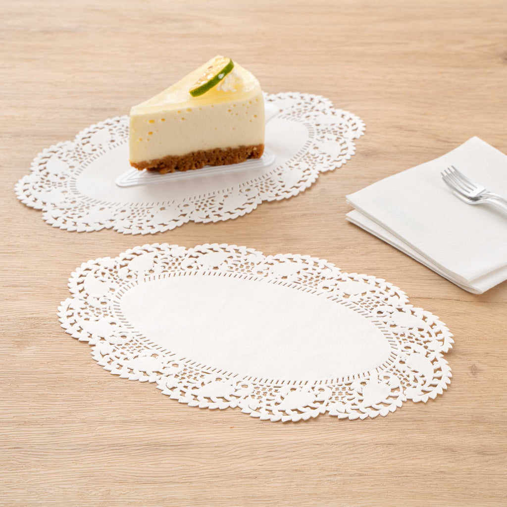 Pastry Tek Oval White Paper Doilies - Lace - 10 1/2" x 6 1/2" - 100 count box