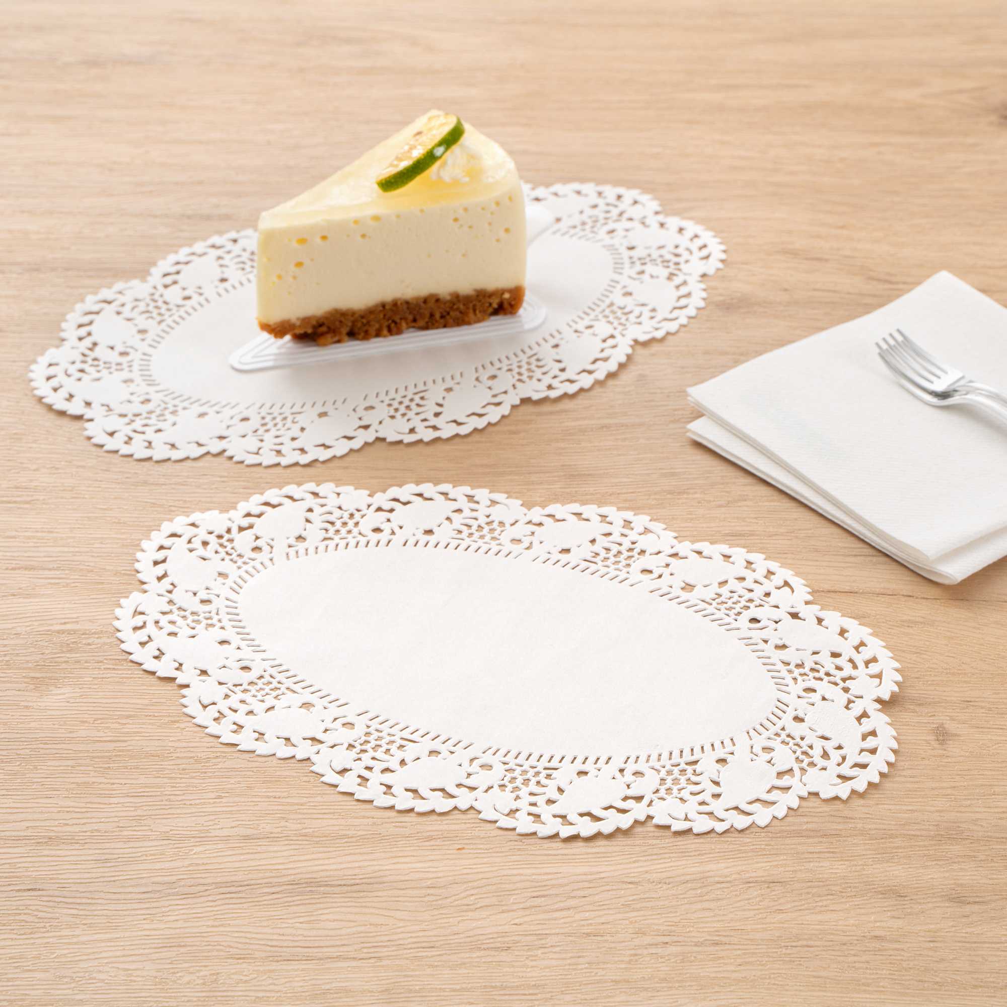 Pastry Tek Oval White Paper Doilies - Lace - 10 1/2" x 6 1/2" - 100 count box