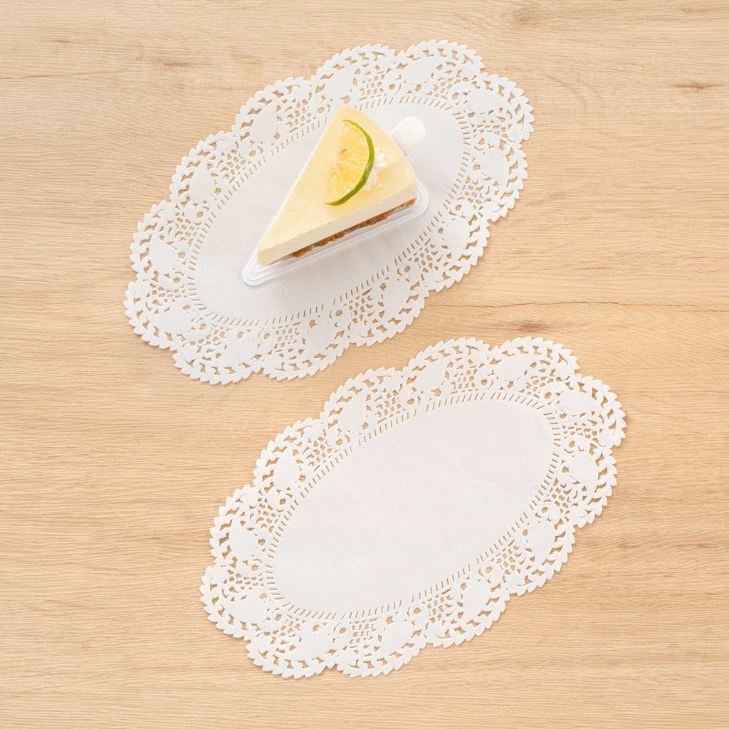 Pastry Tek Oval White Paper Doilies - Lace - 10 1/2" x 6 1/2" - 100 count box