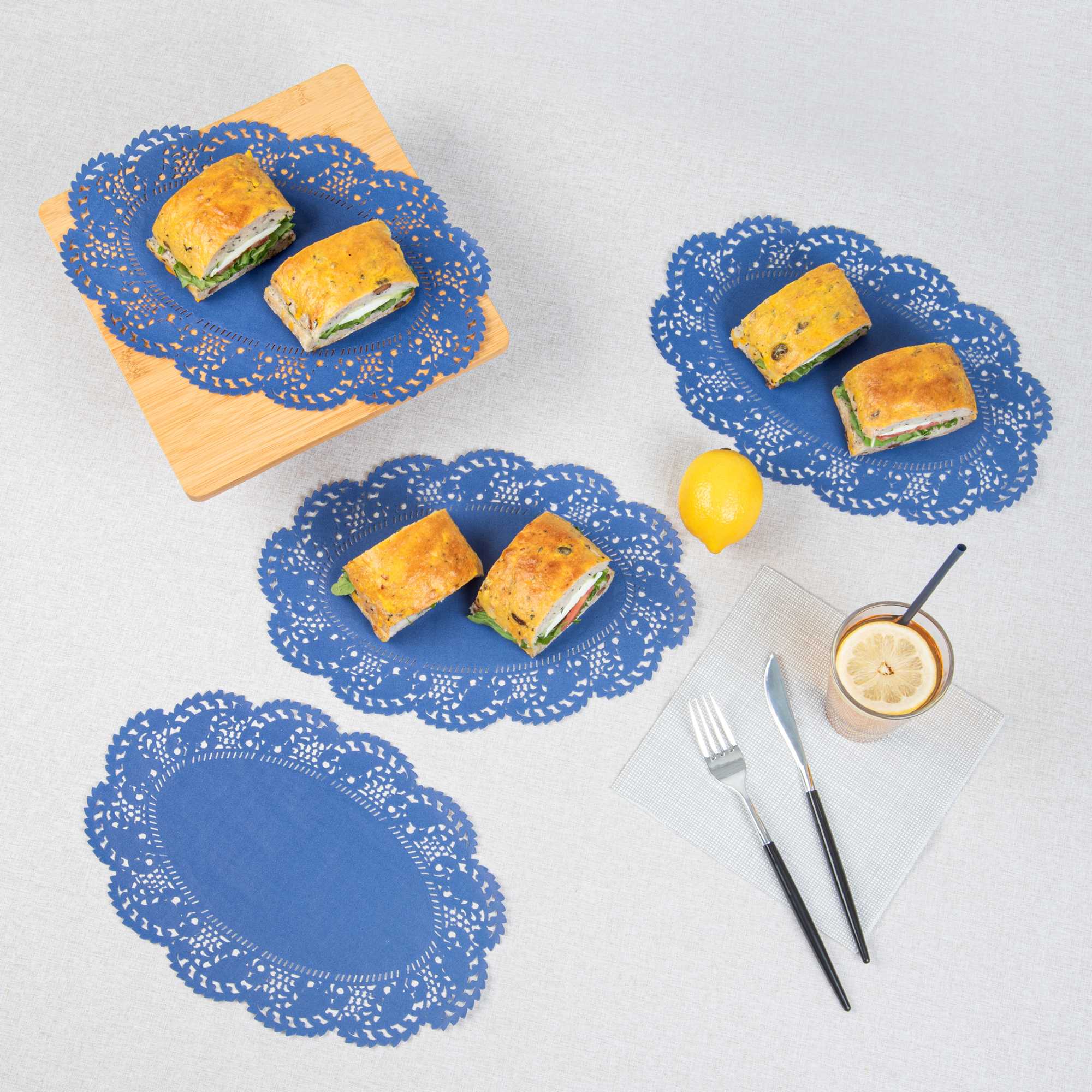 Pastry Tek Oval Navy Blue Paper Doilies - Lace - 12 1/2" x 8 1/2" - 4000 count box