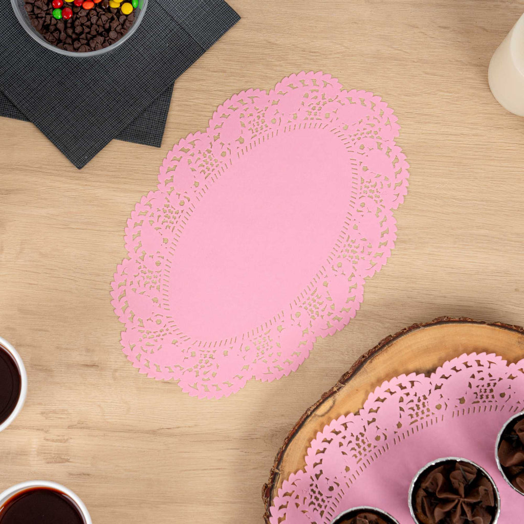 Pastry Tek Oval Pink Paper Doilies - Lace - 12 1/2" x 8 1/2" - 100 count box