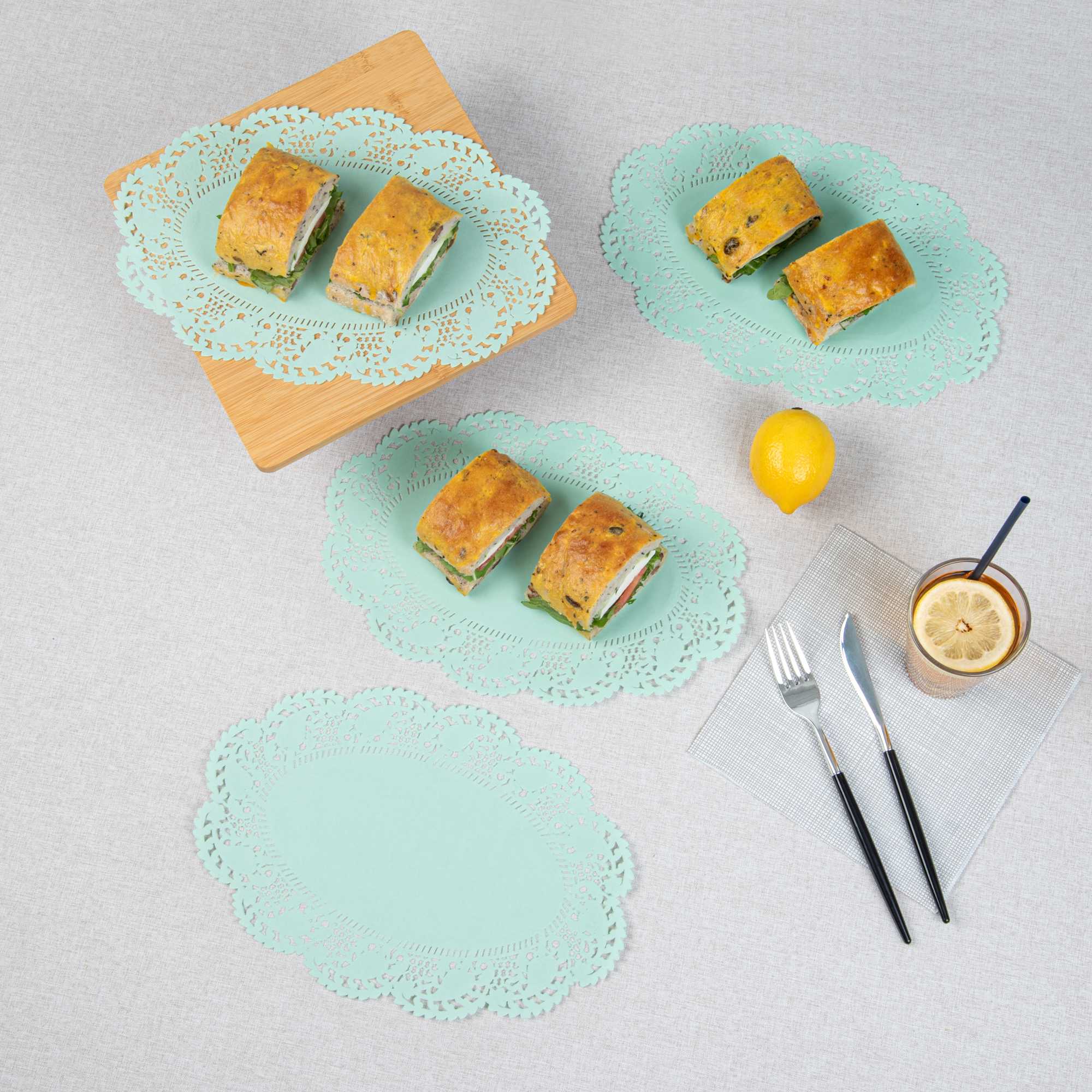 Pastry Tek Oval Teal Paper Doilies - Lace - 12 1/2" x 8 1/2" - 100 count box