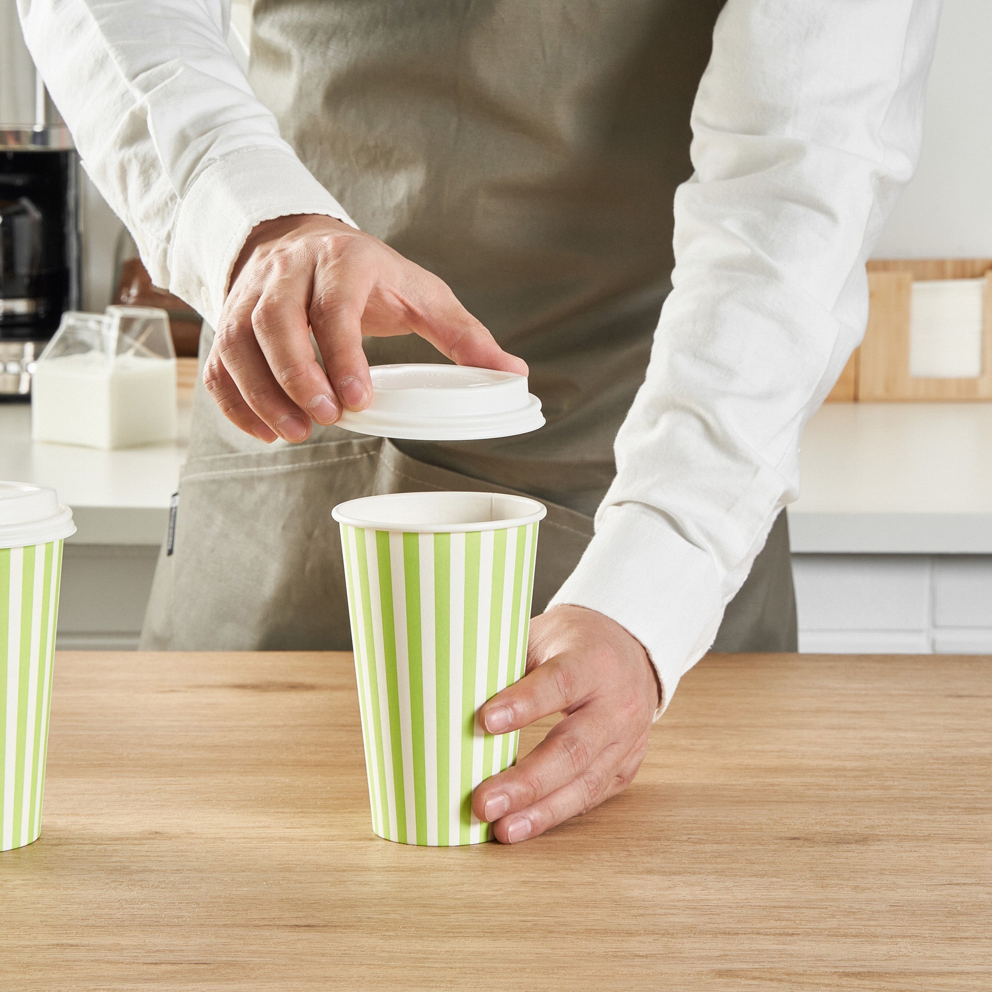 Restpresso 16 oz Green and White Stripe Paper Single Wall Coffee Cup - with White Lid - 3 1/2"x 3 1/2"x 5 3/4" - 400 count box