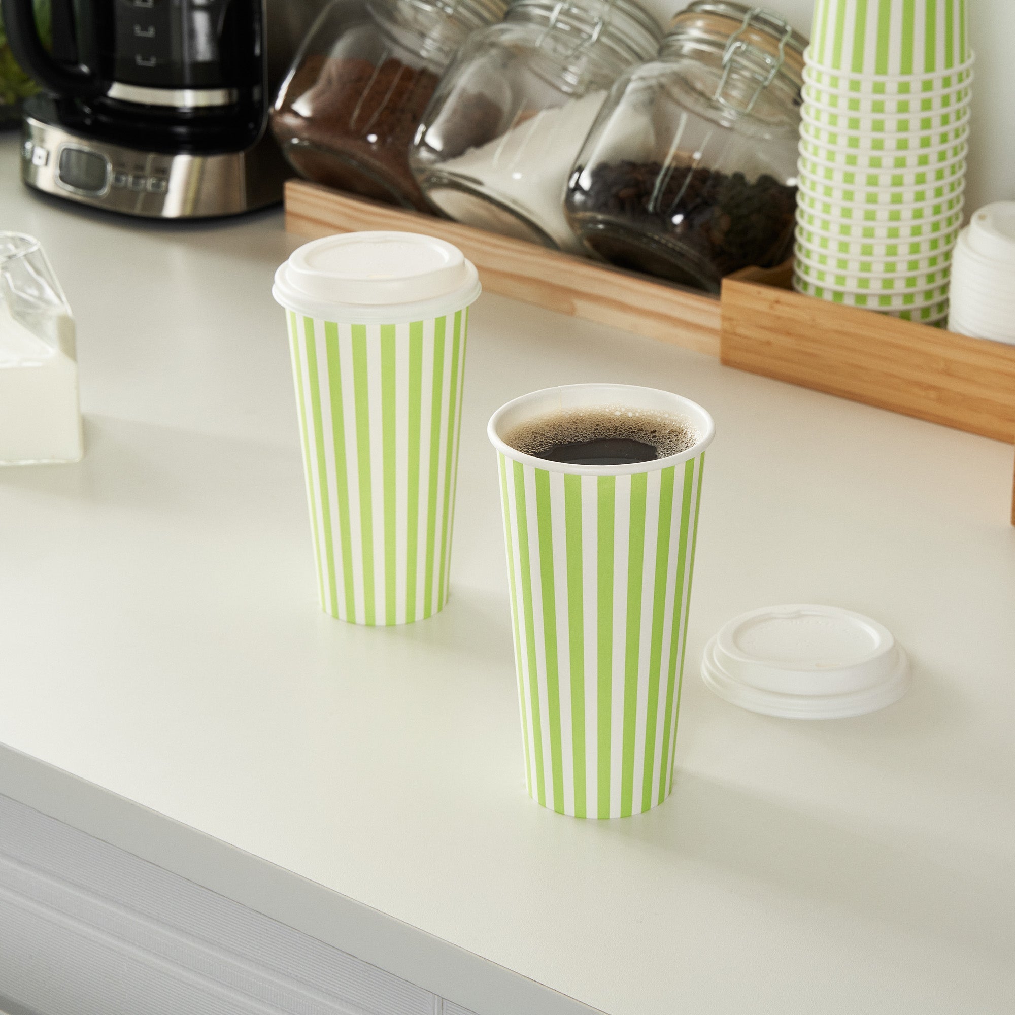 Restpresso 20 oz Green and White Stripe Paper Single Wall Coffee Cup - with White Lid - 3 1/2"x 3 1/2"x 6 1/2" - 20 count box