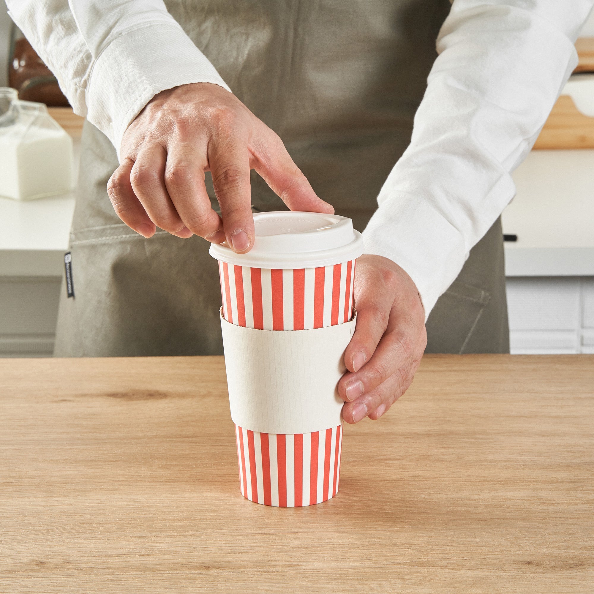 Restpresso 20 oz Red and White Stripe Paper Single Wall Coffee Cup - with White Lid - 3 1/2"x 3 1/2"x 6 1/2" - 20 count box