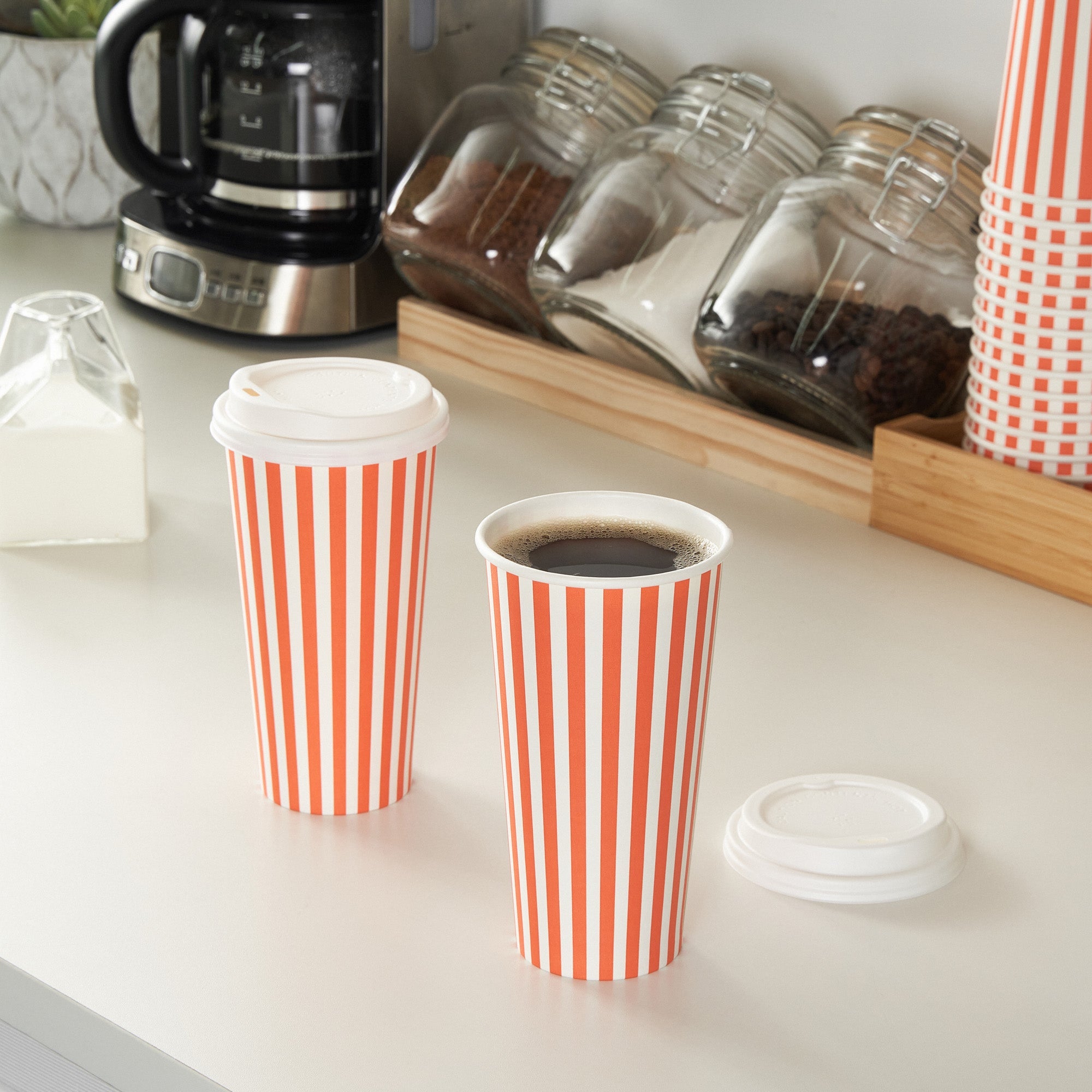 Restpresso 20 oz Orange and White Stripe Paper Single Wall Coffee Cup - with White Lid - 3 1/2"x 3 1/2"x 6 1/2" - 20 count box