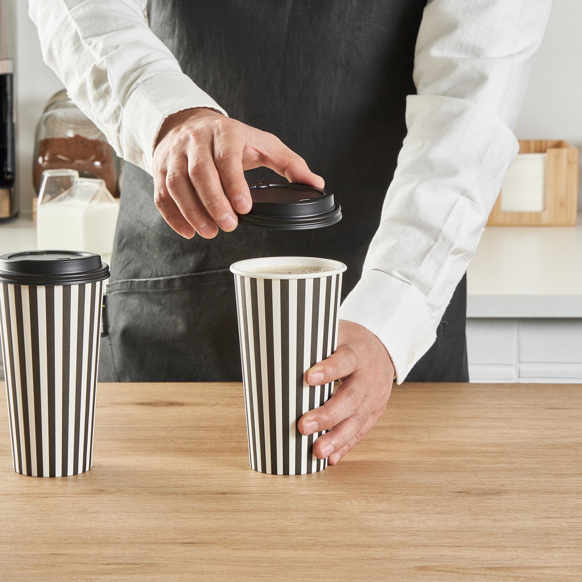 Restpresso 20 oz Black and White Stripe Paper Single Wall Coffee Cup - with Black Lid - 3 1/2"x 3 1/2"x 6 1/4" - 20 count box