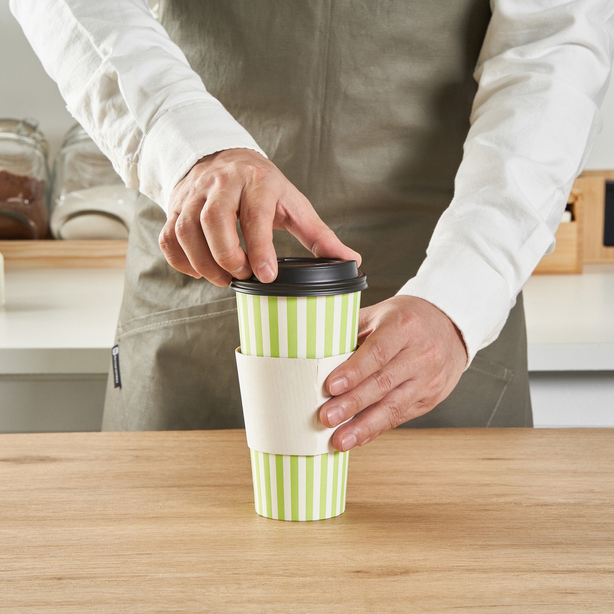 Restpresso 20 oz Green and White Stripe Paper Single Wall Coffee Cup - with Black Lid - 3 1/2"x 3 1/2"x 6 1/4" - 400 count box