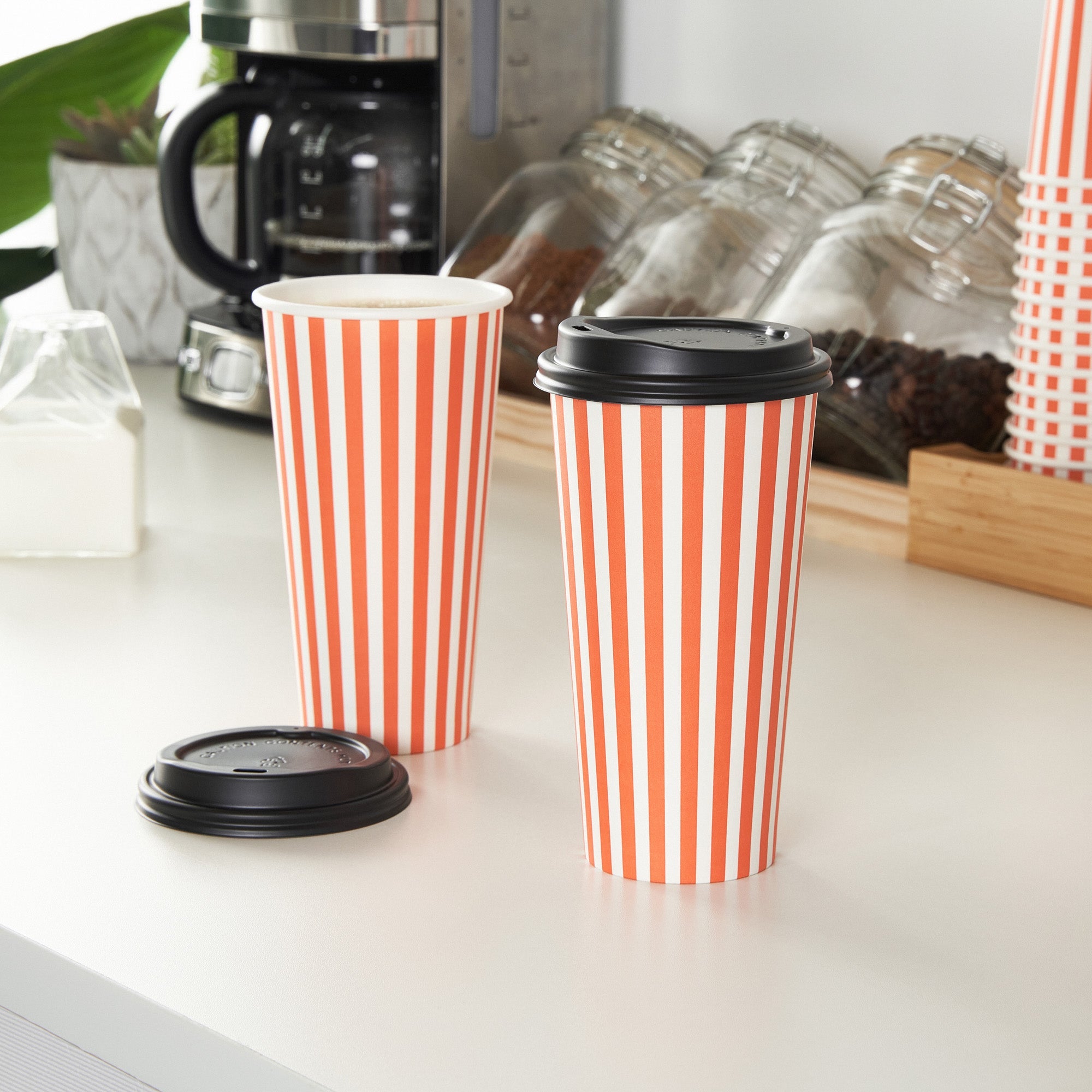 Restpresso 20 oz Orange and White Stripe Paper Single Wall Coffee Cup - with Black Lid - 3 1/2"x 3 1/2"x 6 1/4" - 20 count box
