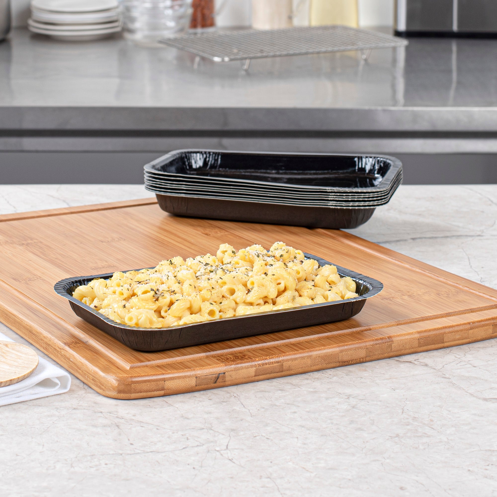 Pastry Tek 15 oz Rectangle Black Paperboard Tray - Oven-Safe - 8 1/4" x 5 1/2" x 1" - 100 count box