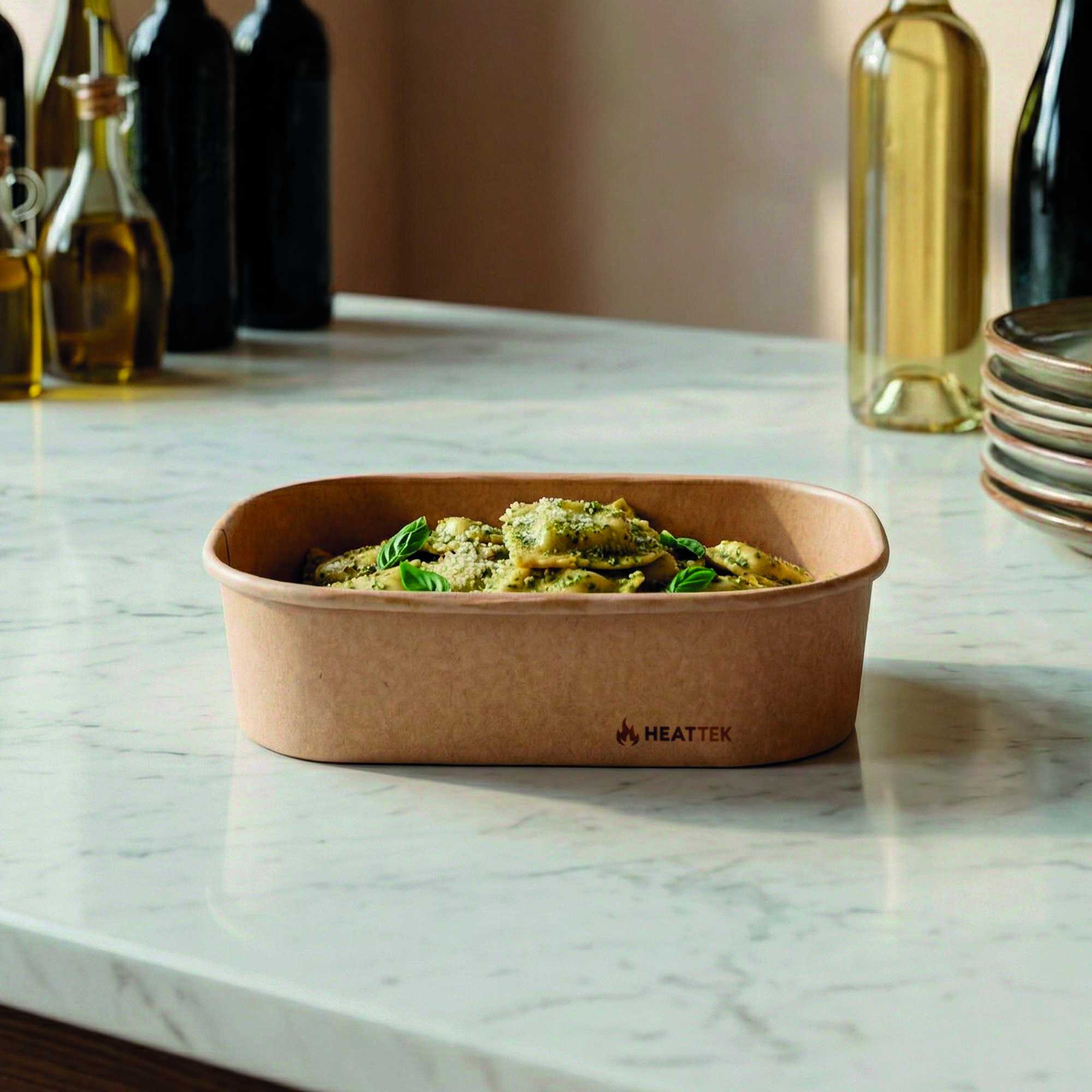 Heat Tek 17 oz Oval Kraft Paper Serving Container - Oven-Safe - 6 3/4" x 4 3/4" x 1 1/2" - 100 count box
