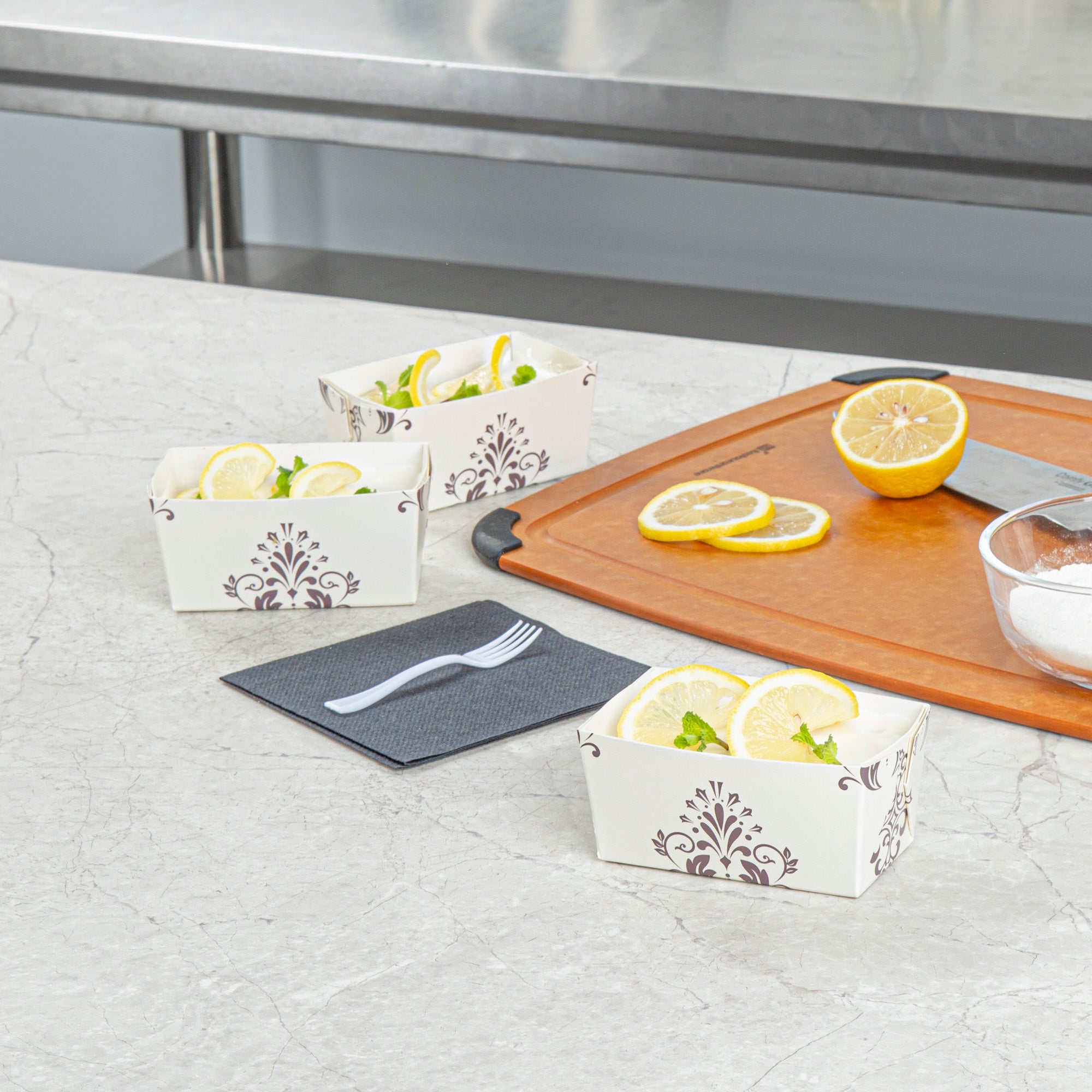 Bake Tek 9 oz Beige Vintage Floral Paper Mini Baking Loaf Pan - Greaseproof - 4" x 2 1/4" x 2" - 100 count box