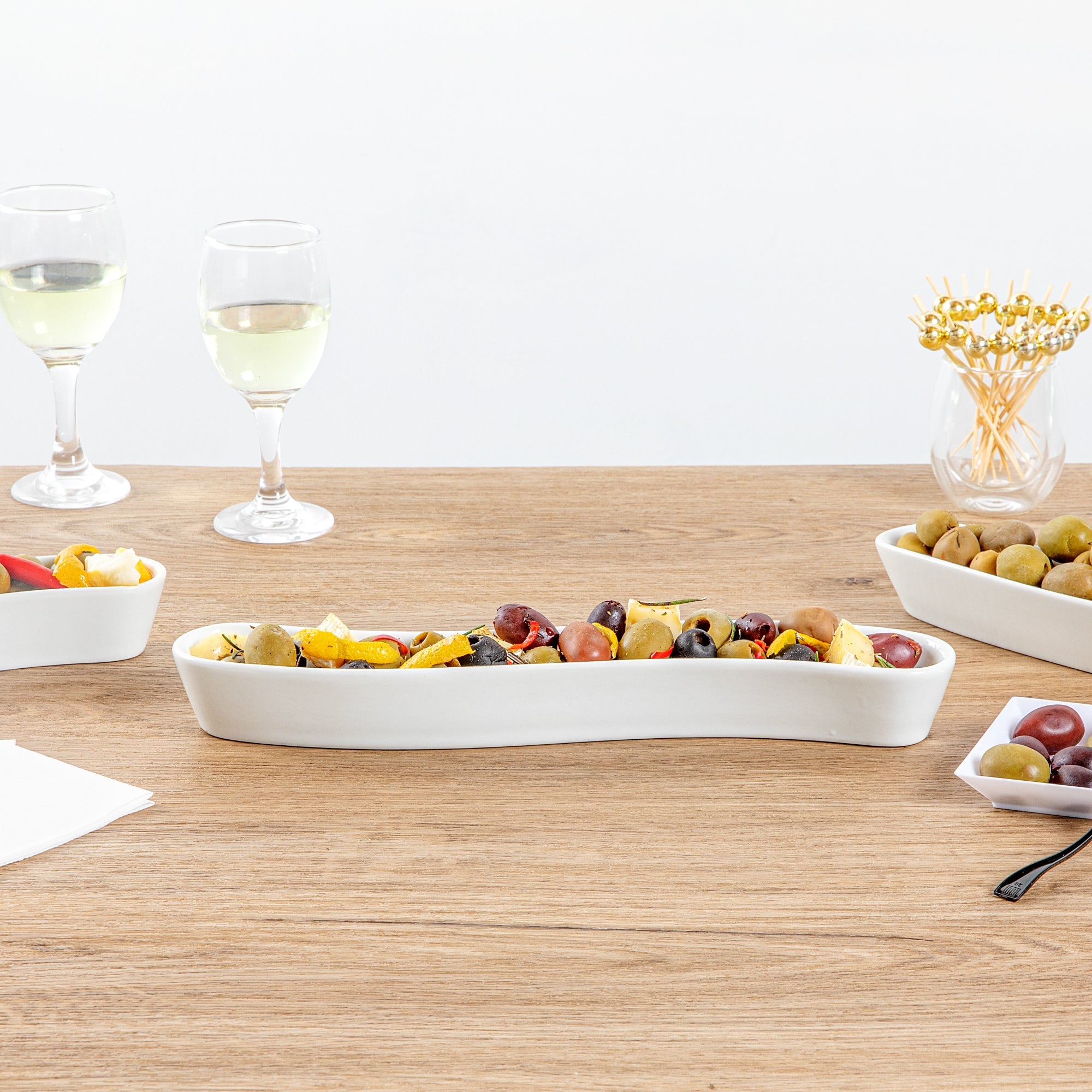 Chef 101 Swerve 10 oz Curved White Porcelain Olive Plate - 12" x 2 1/2" x 1 1/2" - 1 count box