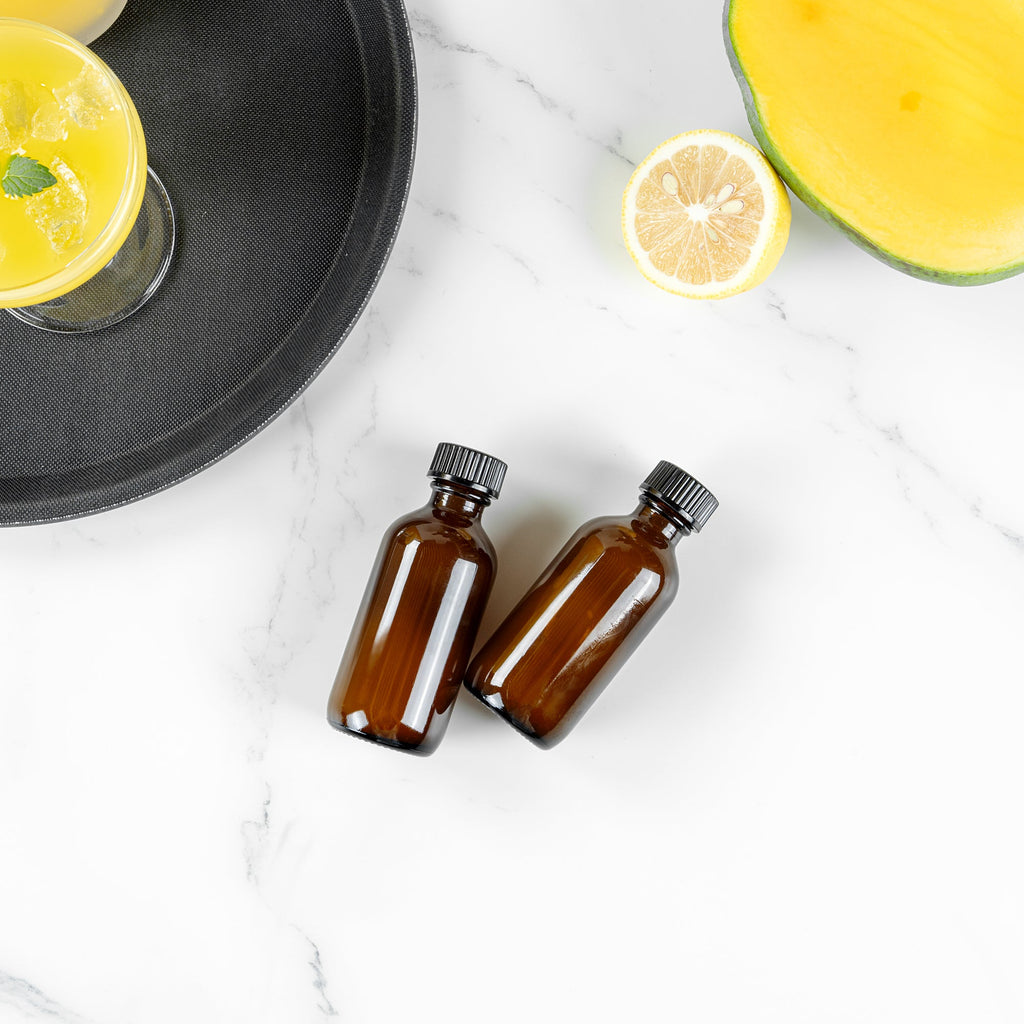 Vetri 2 oz Boston Round Amber Glass Bottle - with Black Phenolic Cap - 1 1/2" x 1 1/2" x 3 3/4" - 48 count box