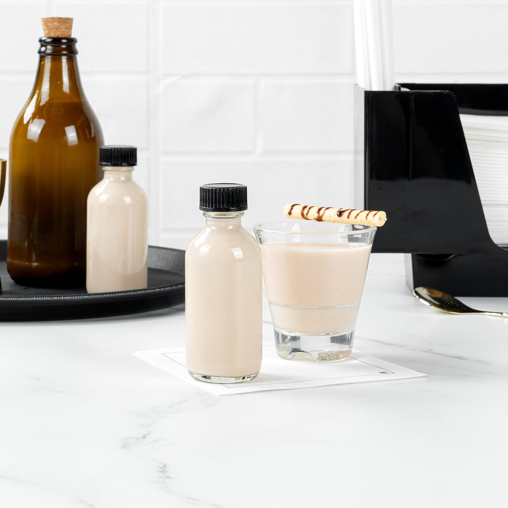 Vetri 2 oz Boston Round Clear Glass Bottle - with Black Phenolic Cap - 1 1/2" x 1 1/2" x 3 3/4" - 48 count box