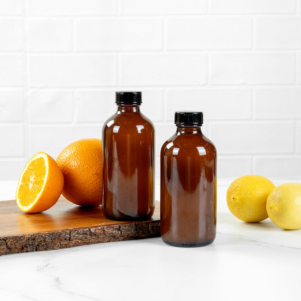 Vetri 8 oz Boston Round Amber Glass Bottle - with Black Phenolic Cap - 2 1/2" x 2 1/2" x 5 1/2" - 12 count box