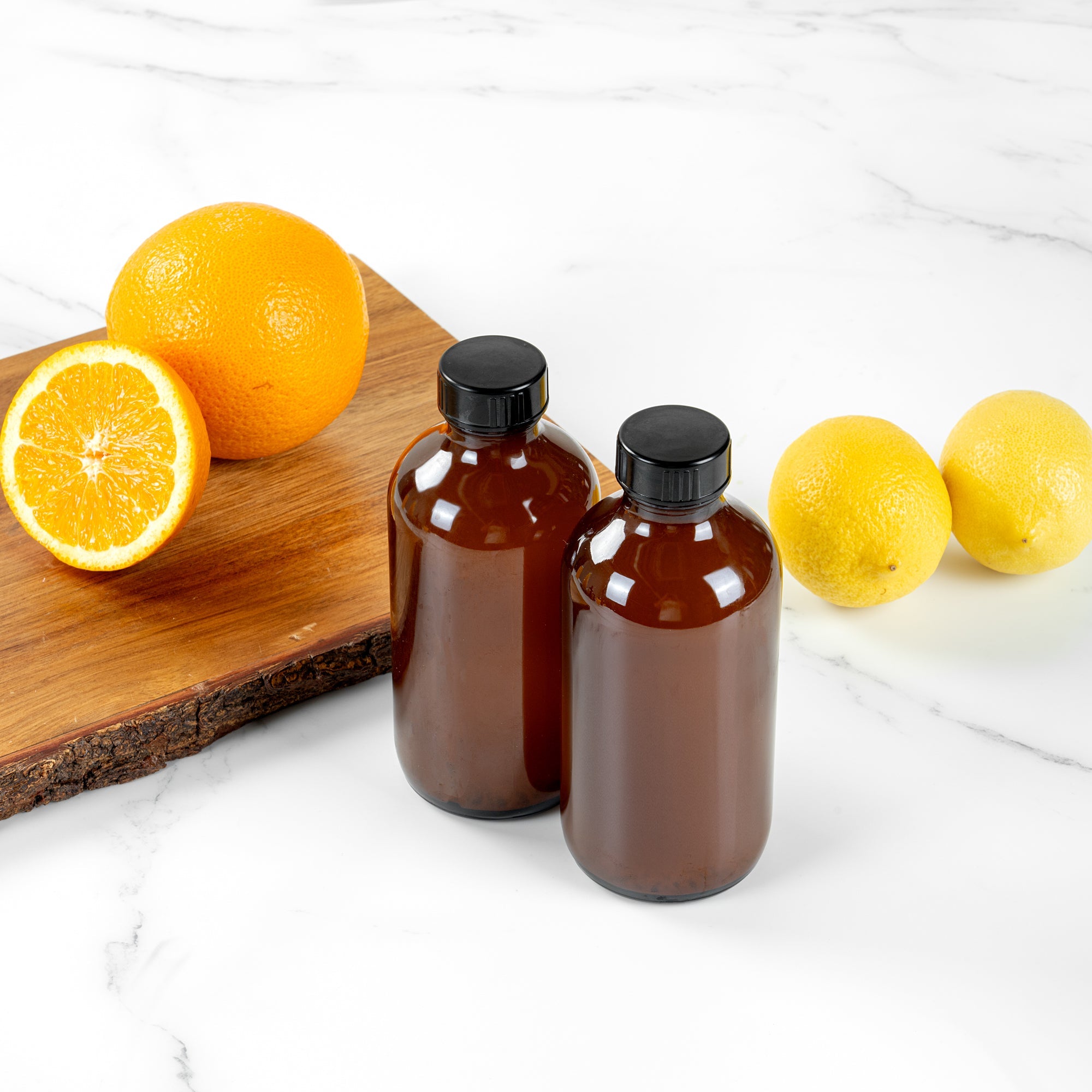 Vetri 8 oz Boston Round Amber Glass Bottle - with Black Phenolic Cap - 2 1/2" x 2 1/2" x 5 1/2" - 12 count box