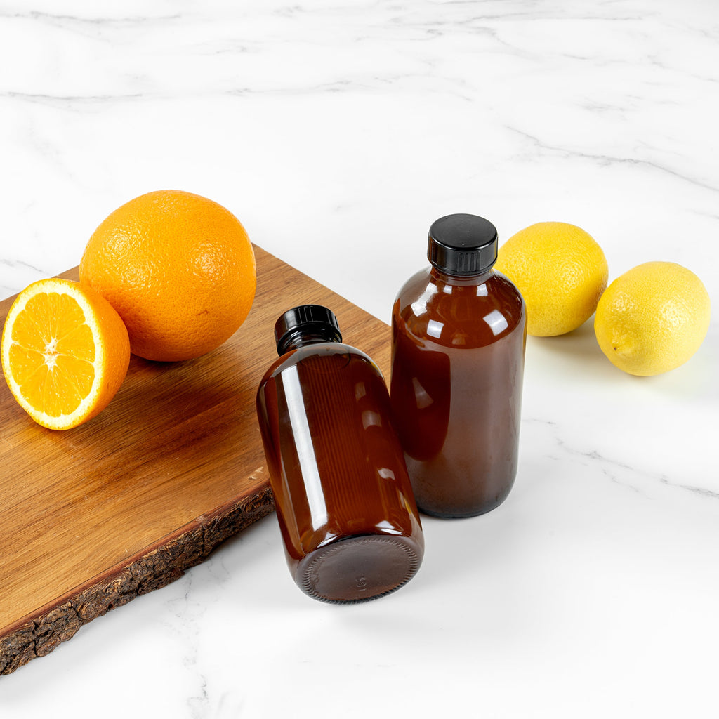 Vetri 8 oz Boston Round Amber Glass Bottle - with Black Phenolic Cap - 2 1/2" x 2 1/2" x 5 1/2" - 12 count box