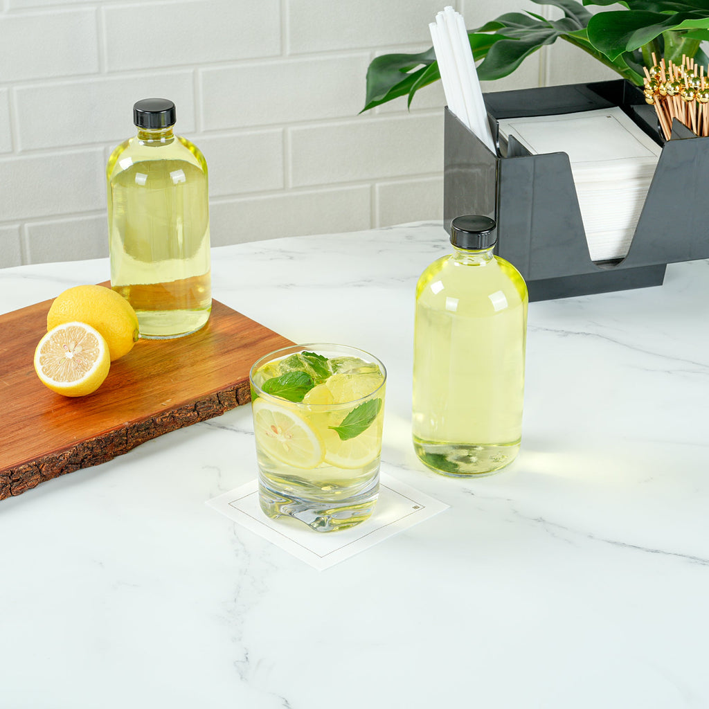 Vetri 16 oz Boston Round Clear Glass Bottle - with Black Phenolic Cap - 3" x 3" x 6 3/4" - 12 count box