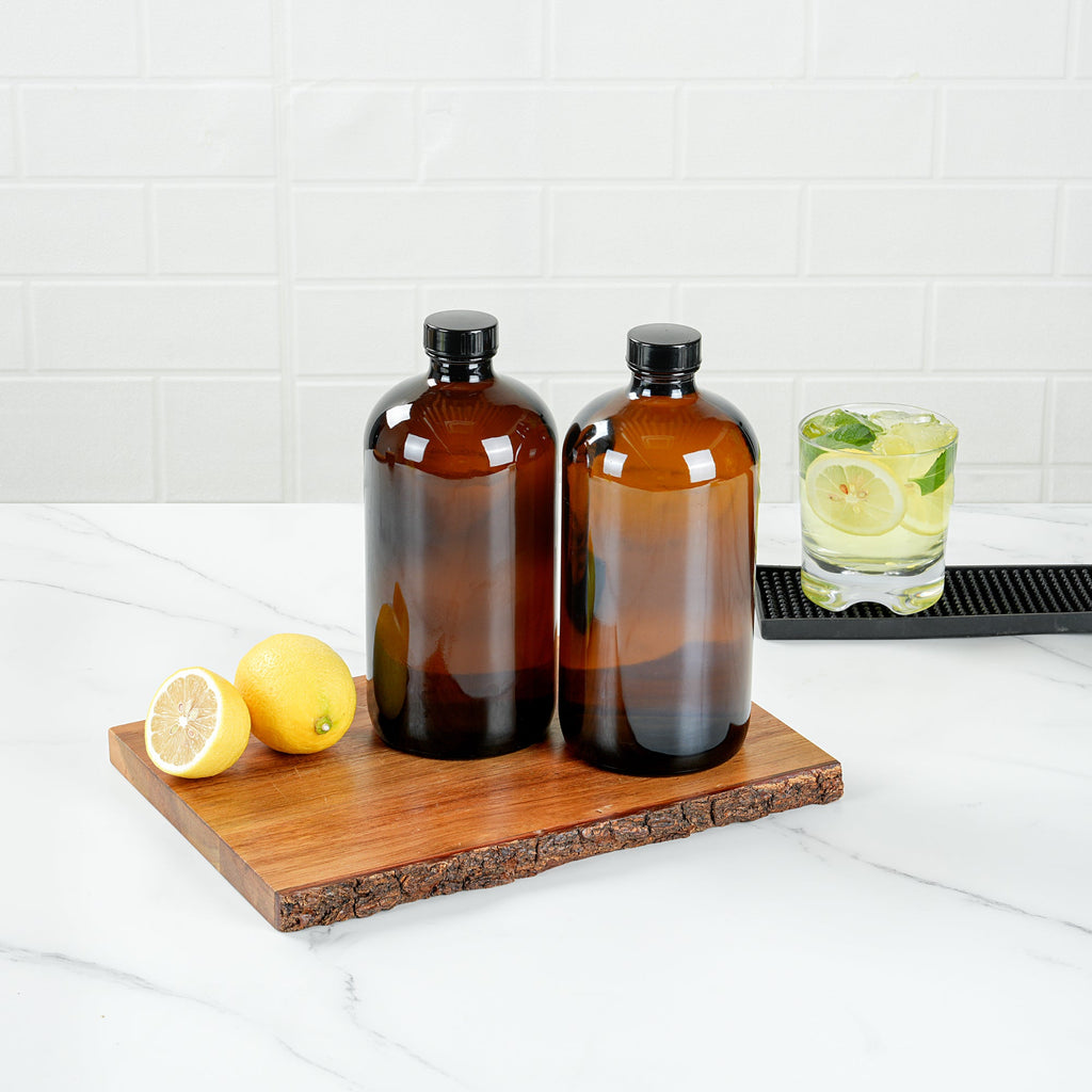 Vetri 32 oz Boston Round Amber Glass Bottle - with Black Phenolic Cap - 3 3/4" x 3 3/4" x 8" - 12 count box